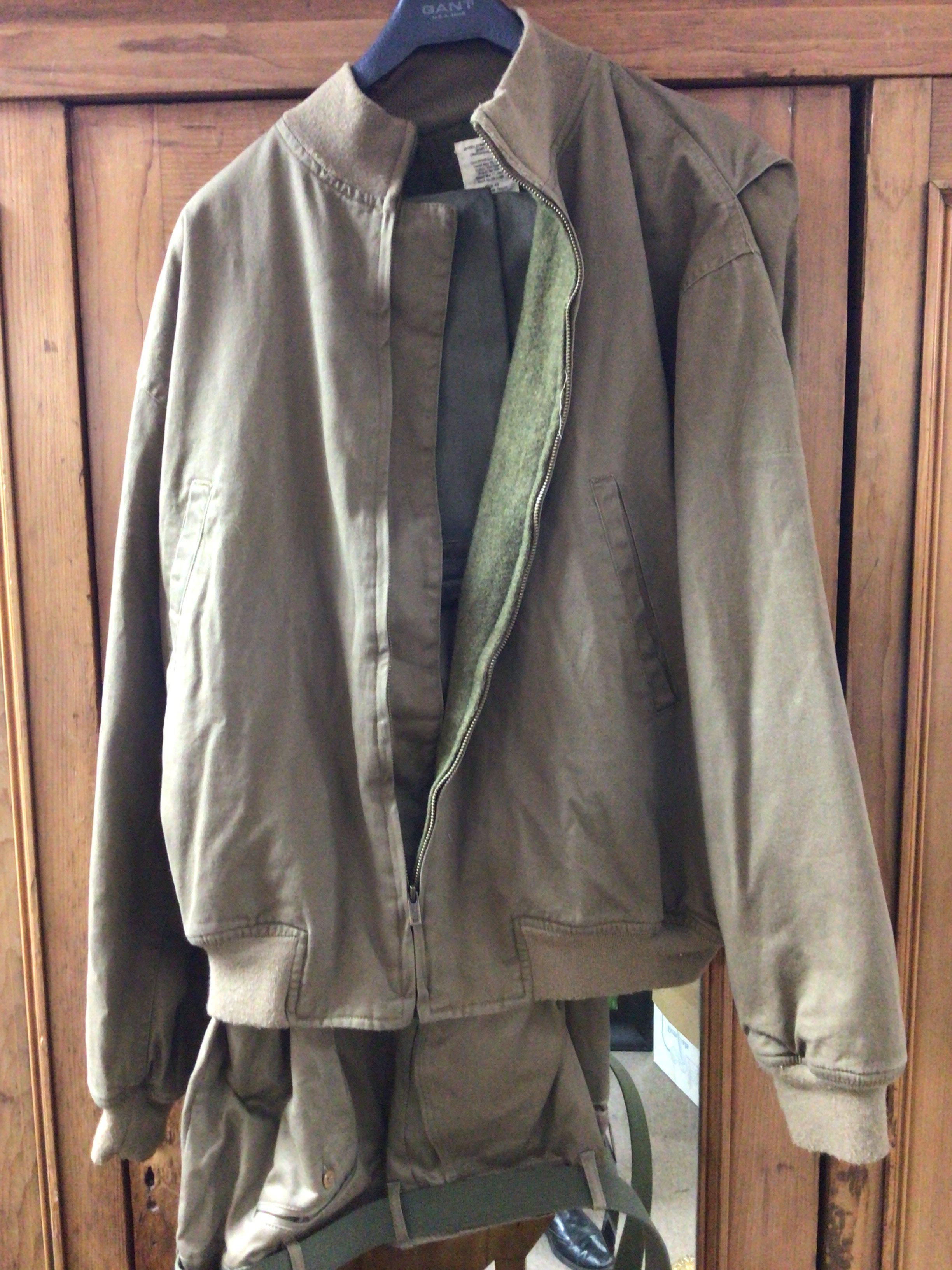 An American Military issue jacket and trousers combat winter jacket in label.