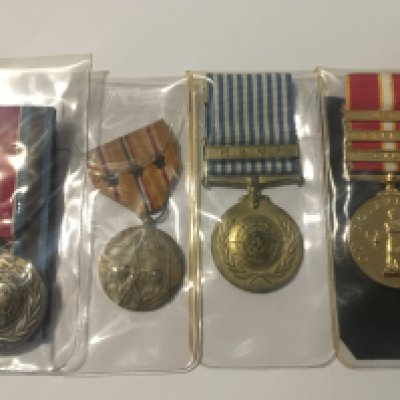A Collection of medals A United Nations Medal Korea one other UN medal An active service medal three bar Gulf Cyprus Bosnia and an American Pacific Campaign medal three star.