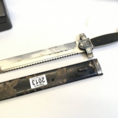 A Rare German Third Reich II world war dagger with saw edge blade The DRK Red Cross Hewer. All original condition with makers stamp under the eagle cross bar.
