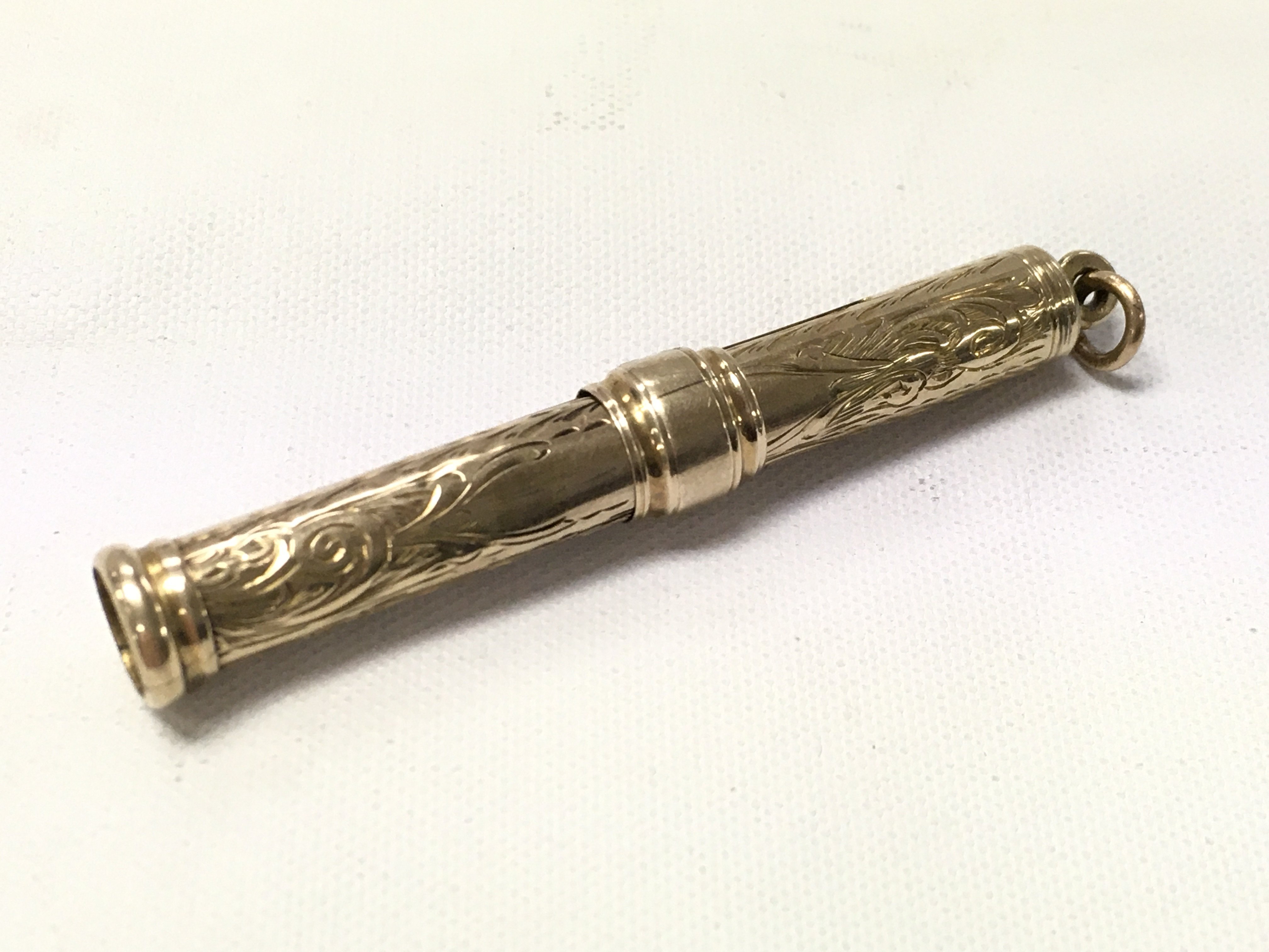 A 9ct gold propelling pencil. 5.2g total weight. Postage category A