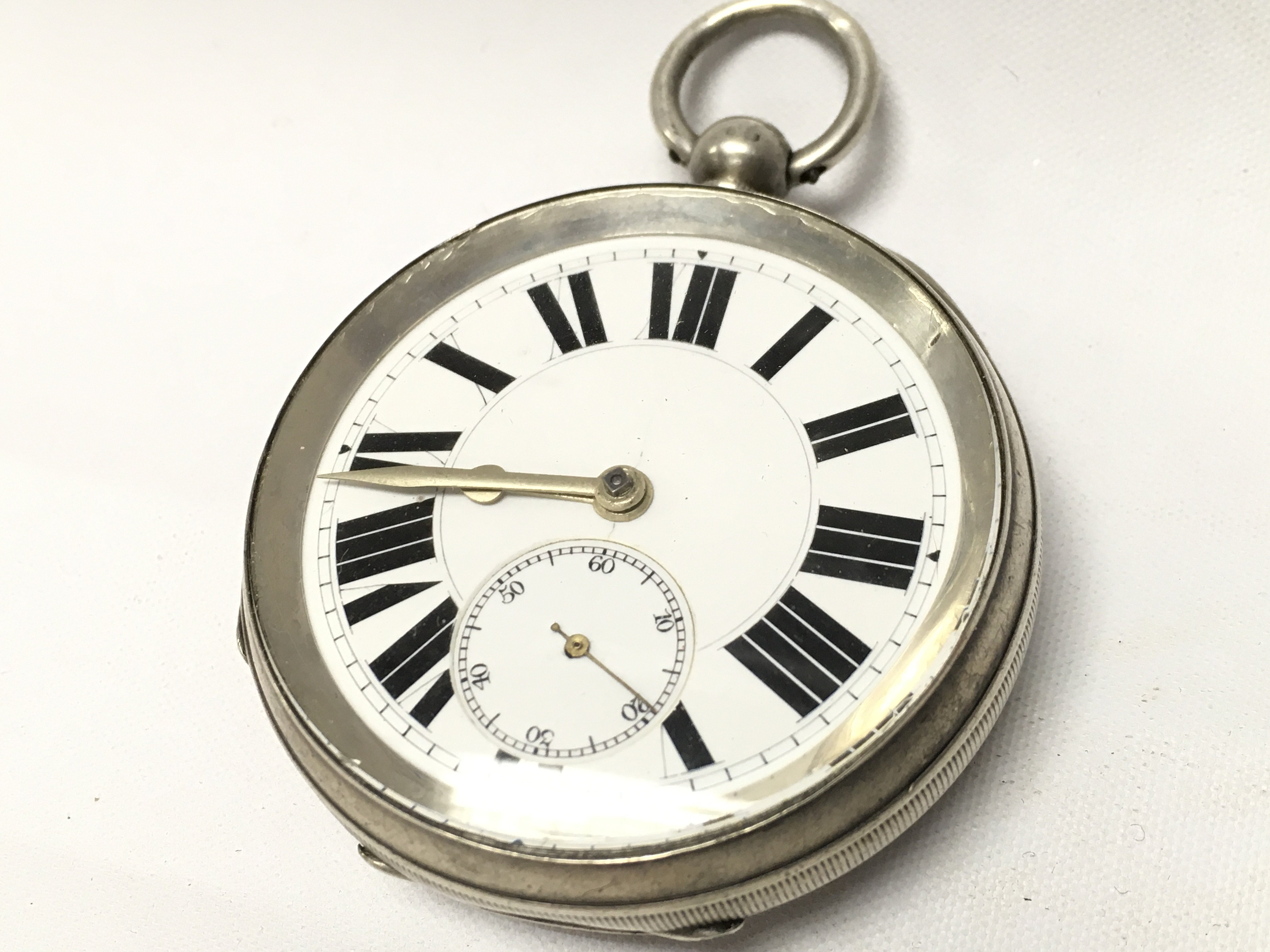 A silver hallmarked cased pocket watch , seen working. Postage category A