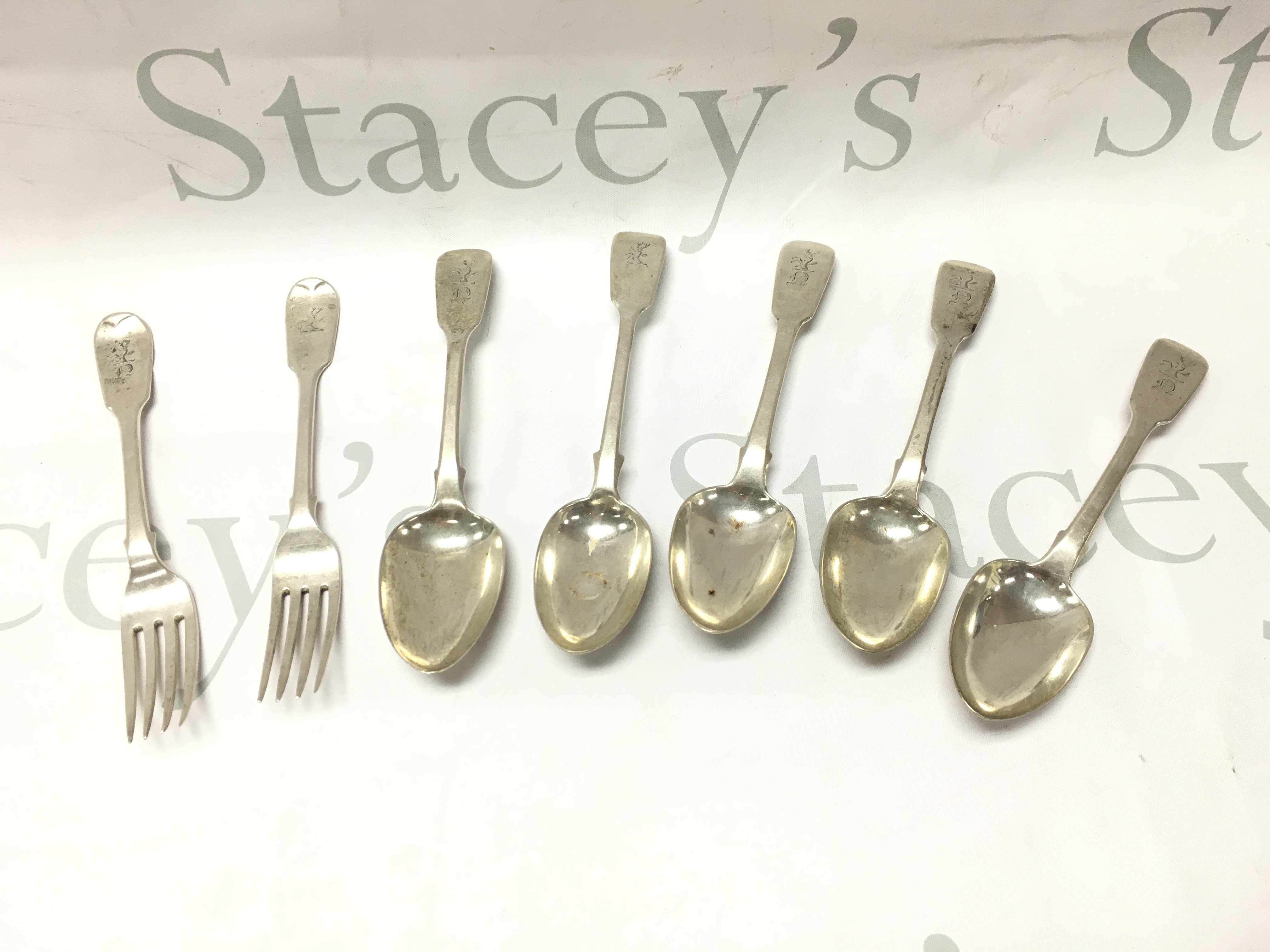 A collection of silver hallmarked cutlery including spoons and forks , postage category A
