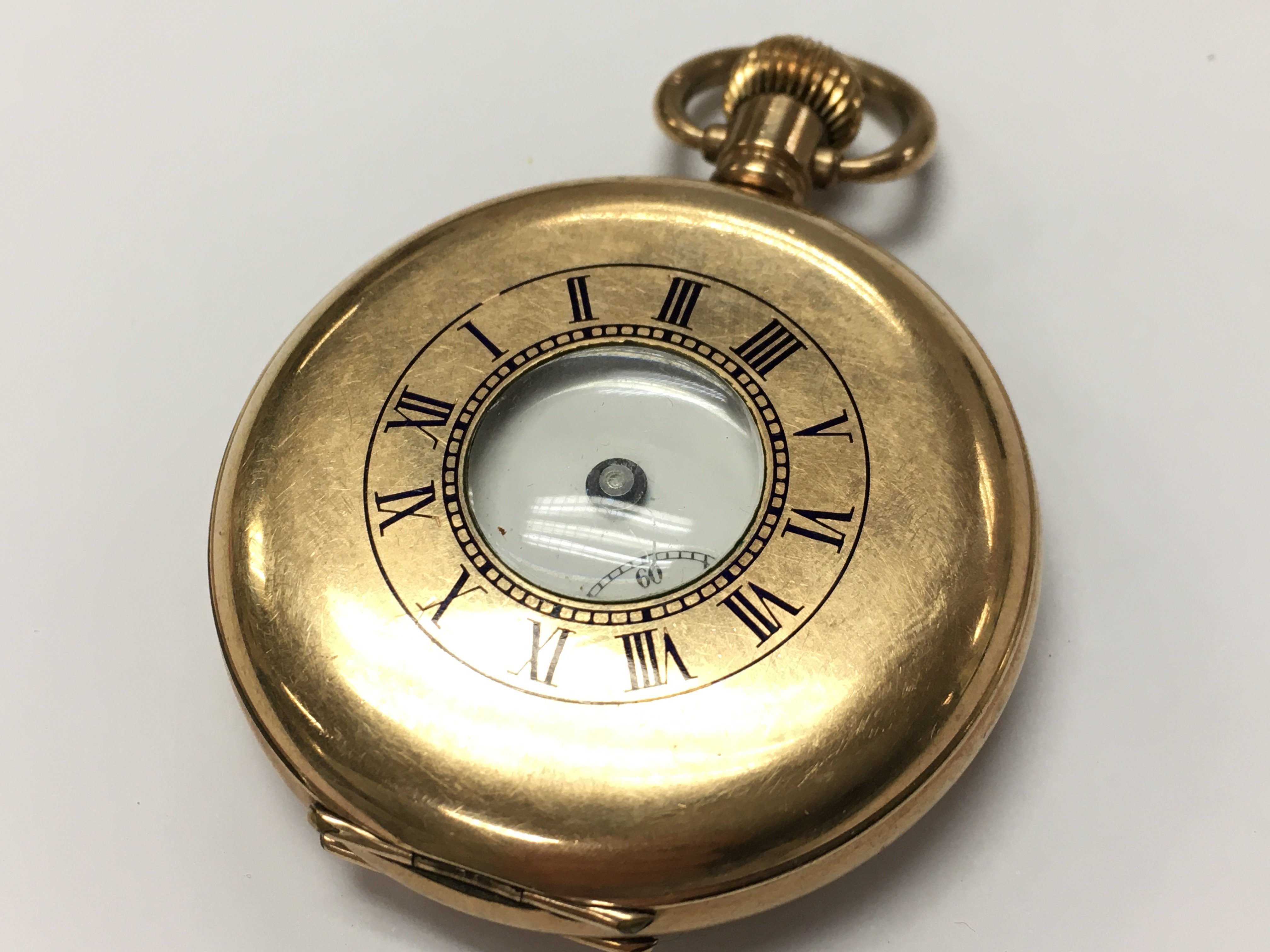 A gold plated watch . Postage category A