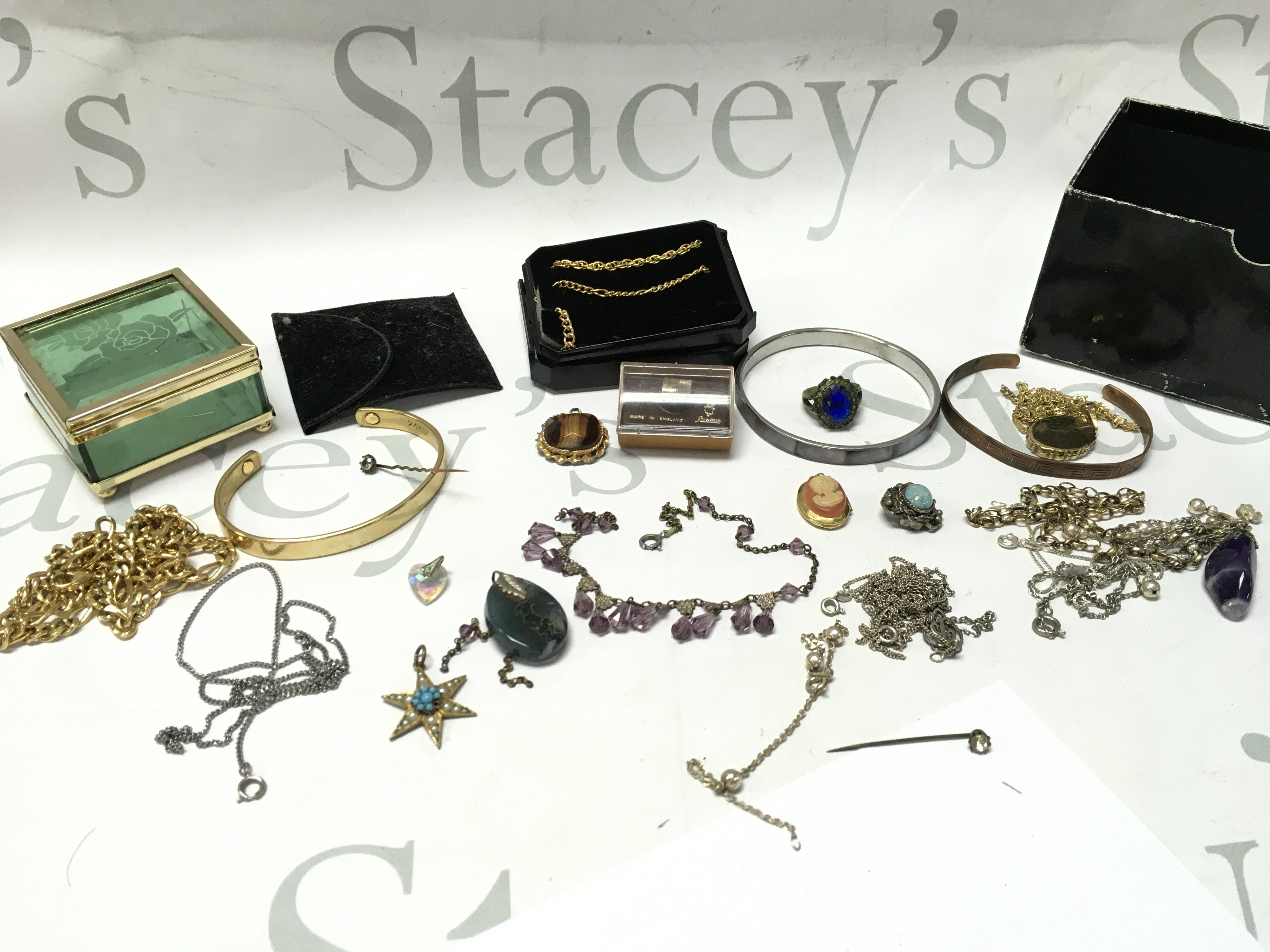 A collection of costume jewellery including necklaces, bracelets, brooches . Postage category B