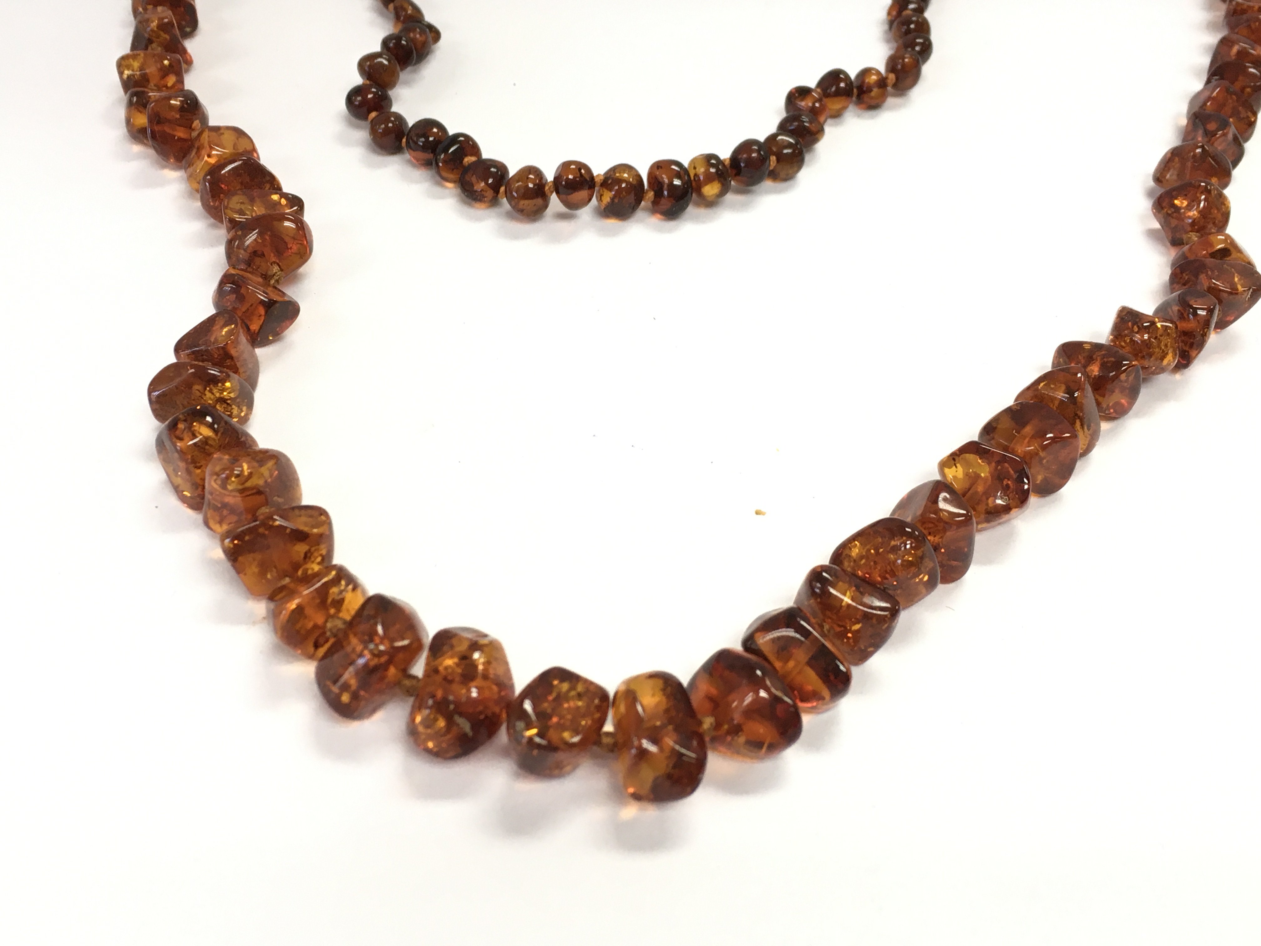 A collection of amber jewellery including necklaces and bracelet. Postage B. NO RESERVE