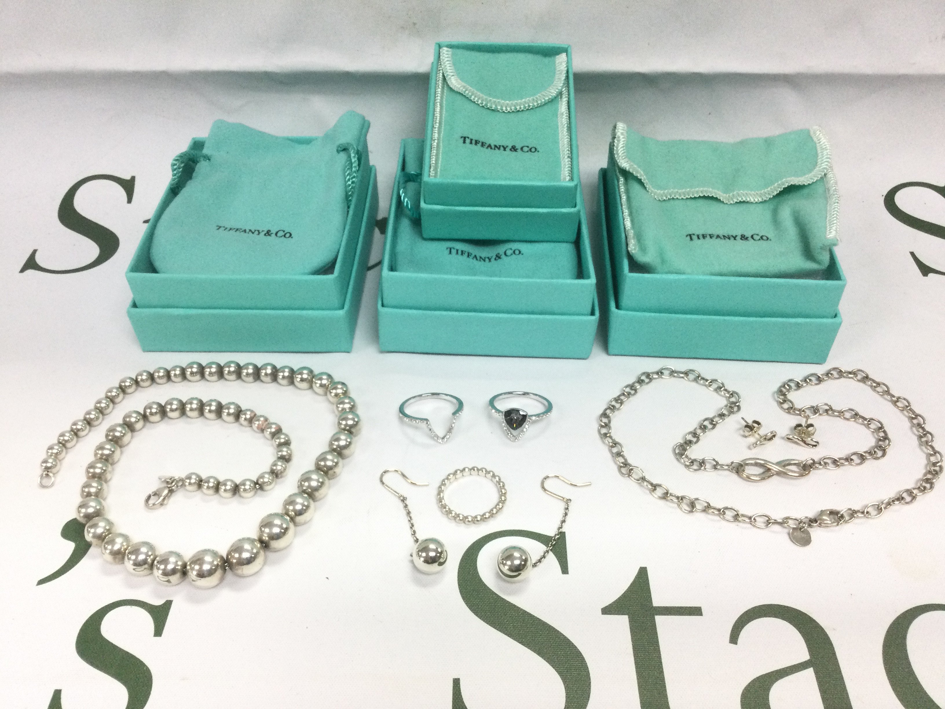A collection of boxed Tiffany & Co jewellery. Shipping category A.