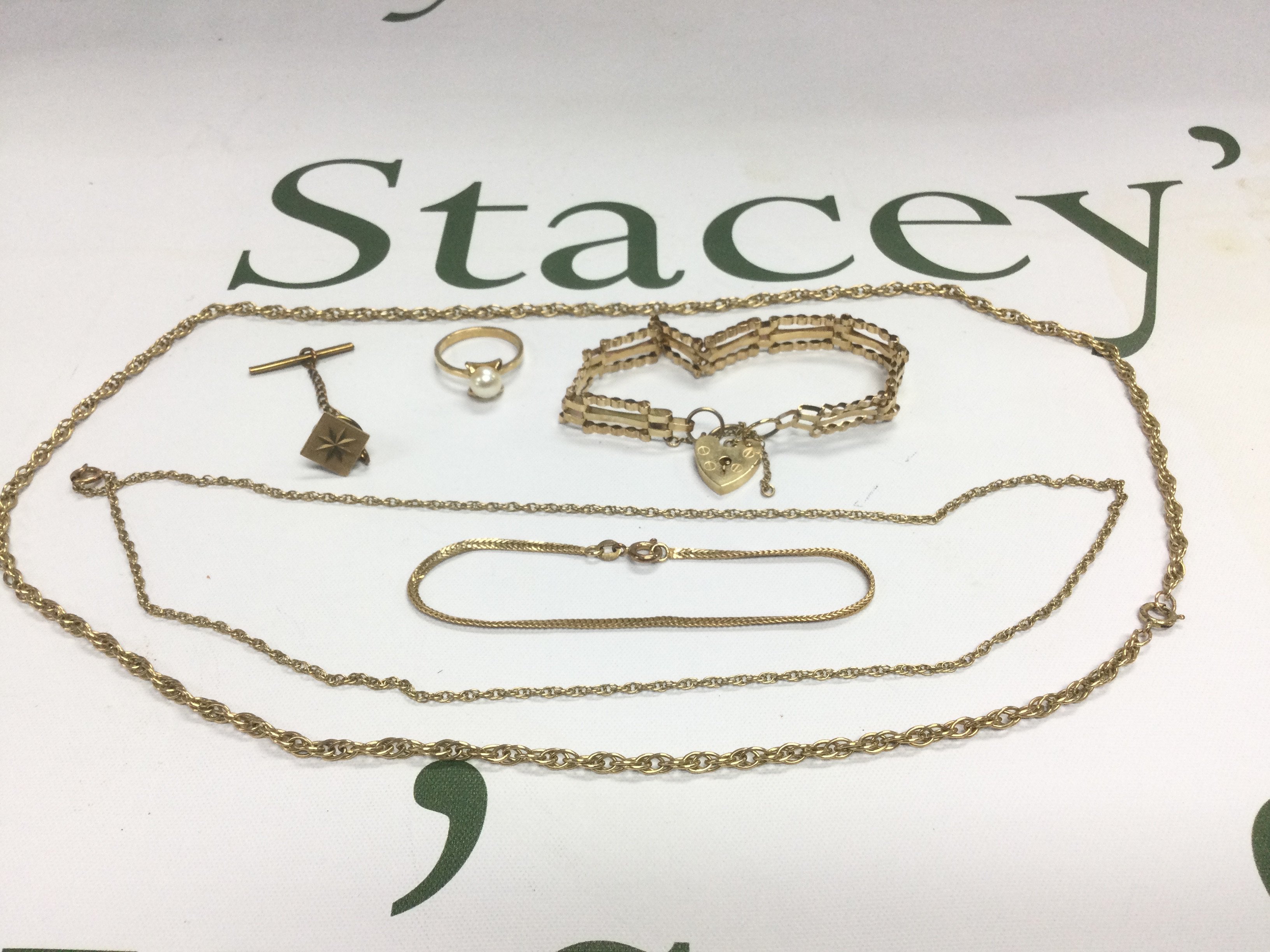 A collection of gold jewellery comprising chains, bracelet etc. Shipping category A.