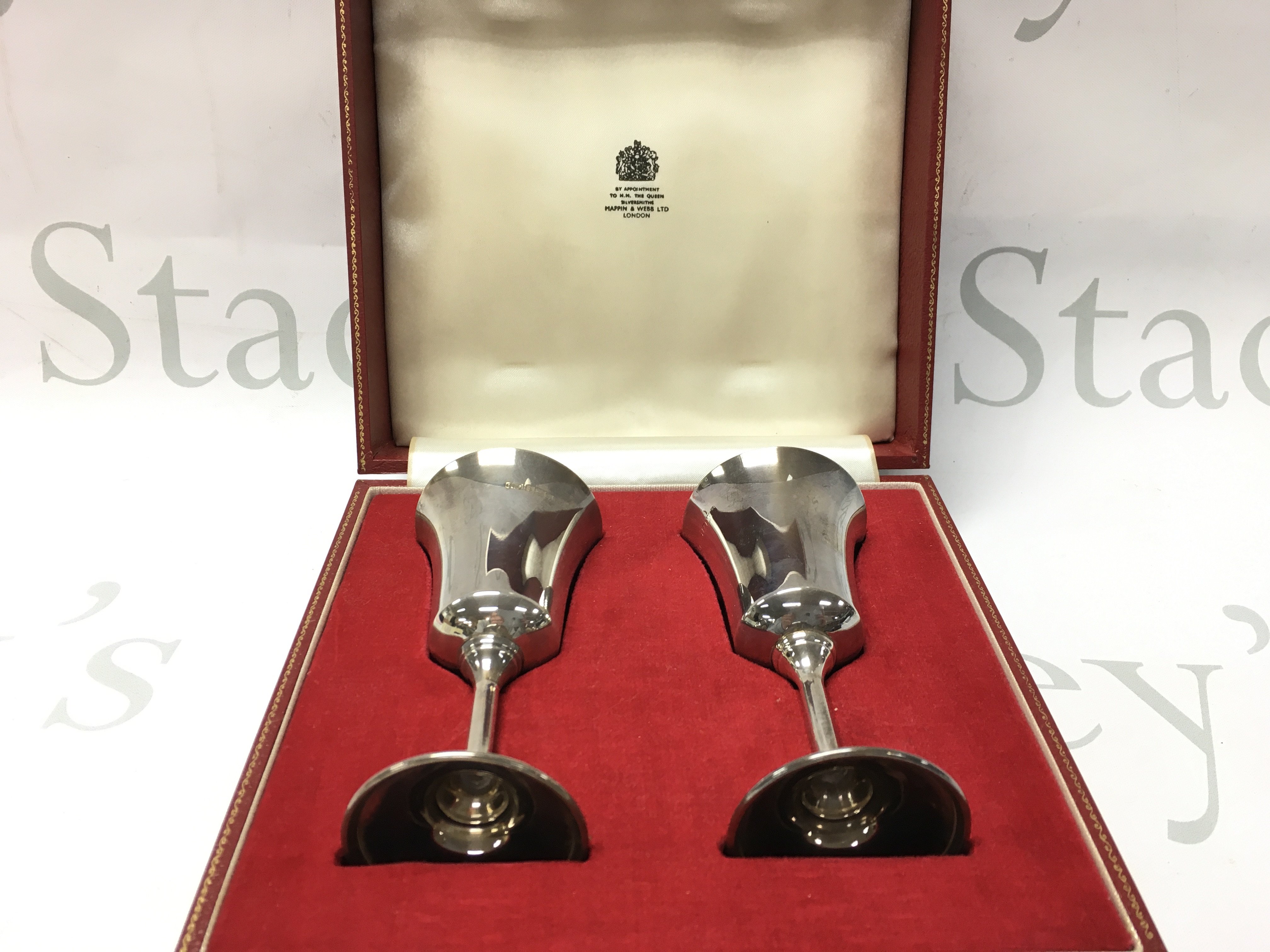 A cased pair of silver hallmarked wine cups . Postage category B