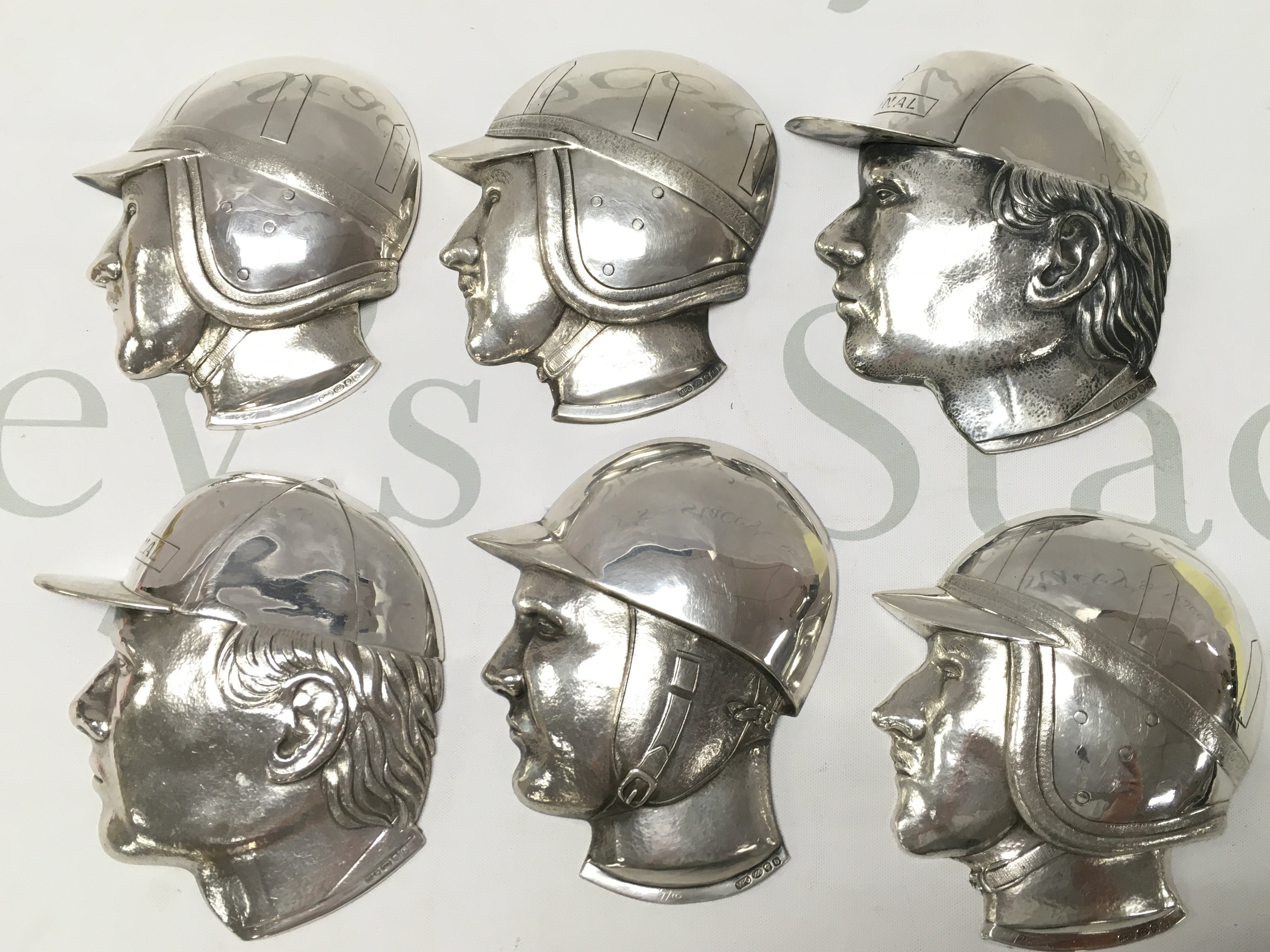 Hallmarked silver racing driver plaques , postage category A