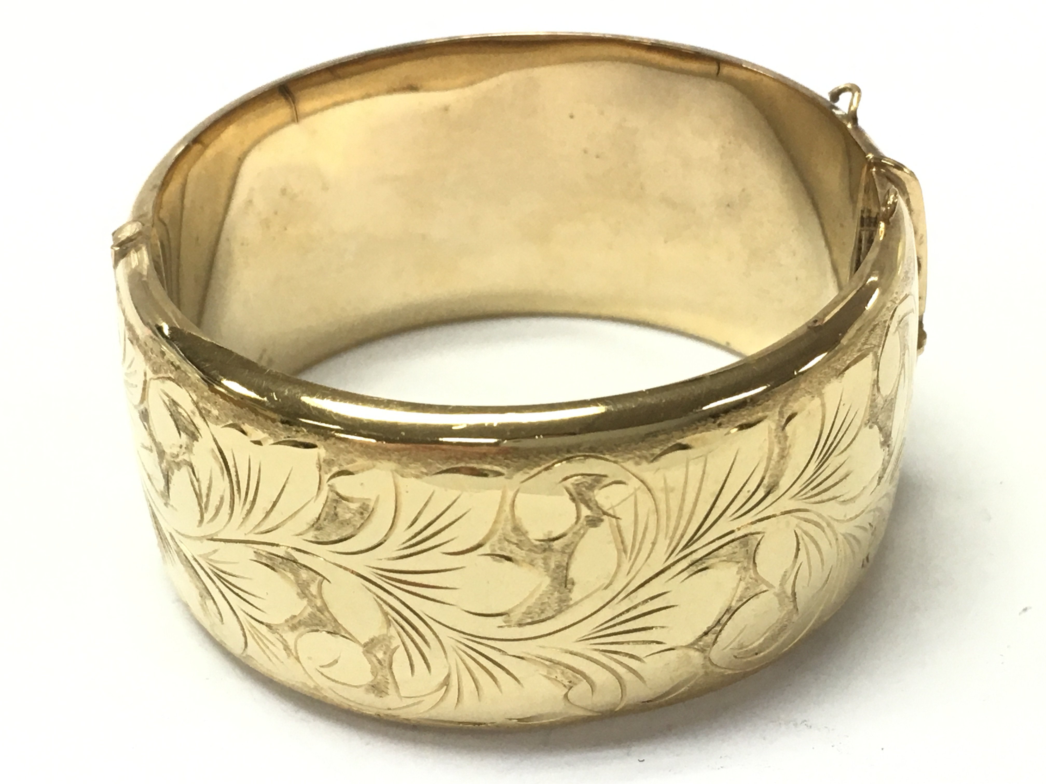A heavy rolled gold bangle , 53g. Postage category A