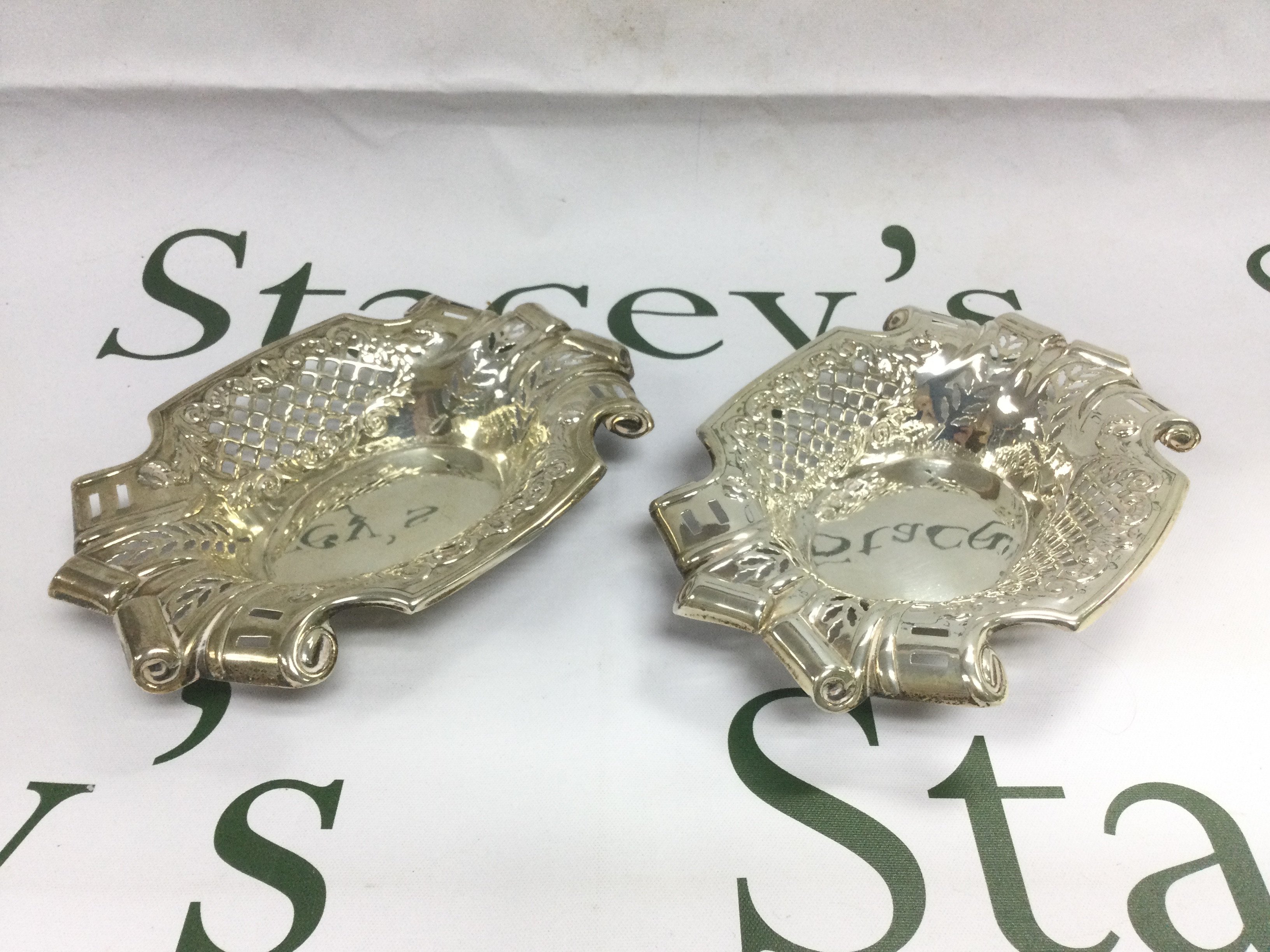 A pair of piercework silver dishes, approx length 15cm. Shipping category B.