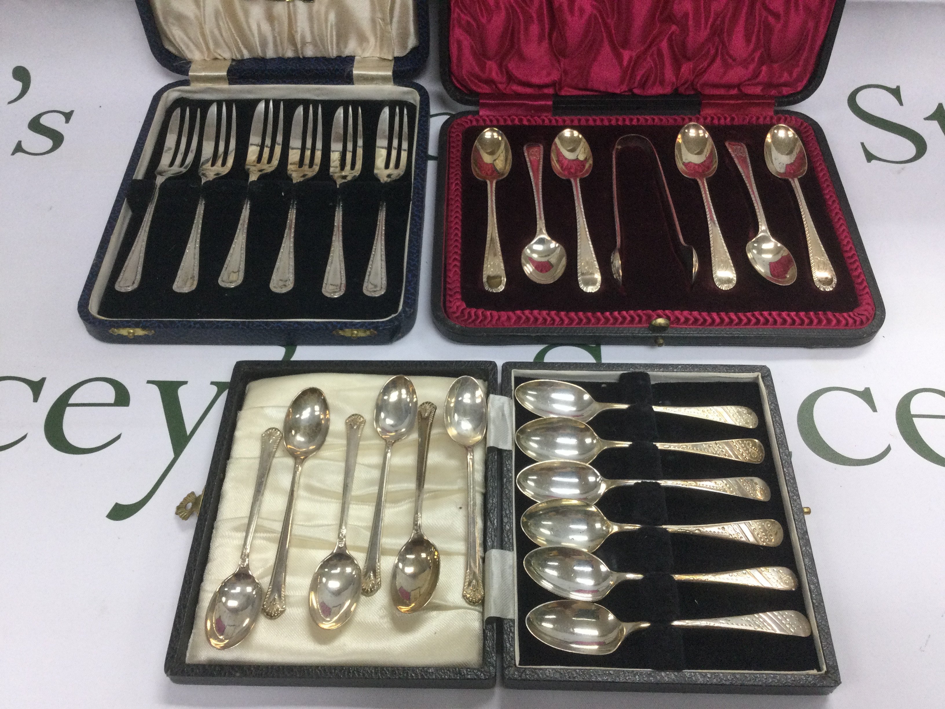 Three cased sets of silver cutlery. Shipping category B.