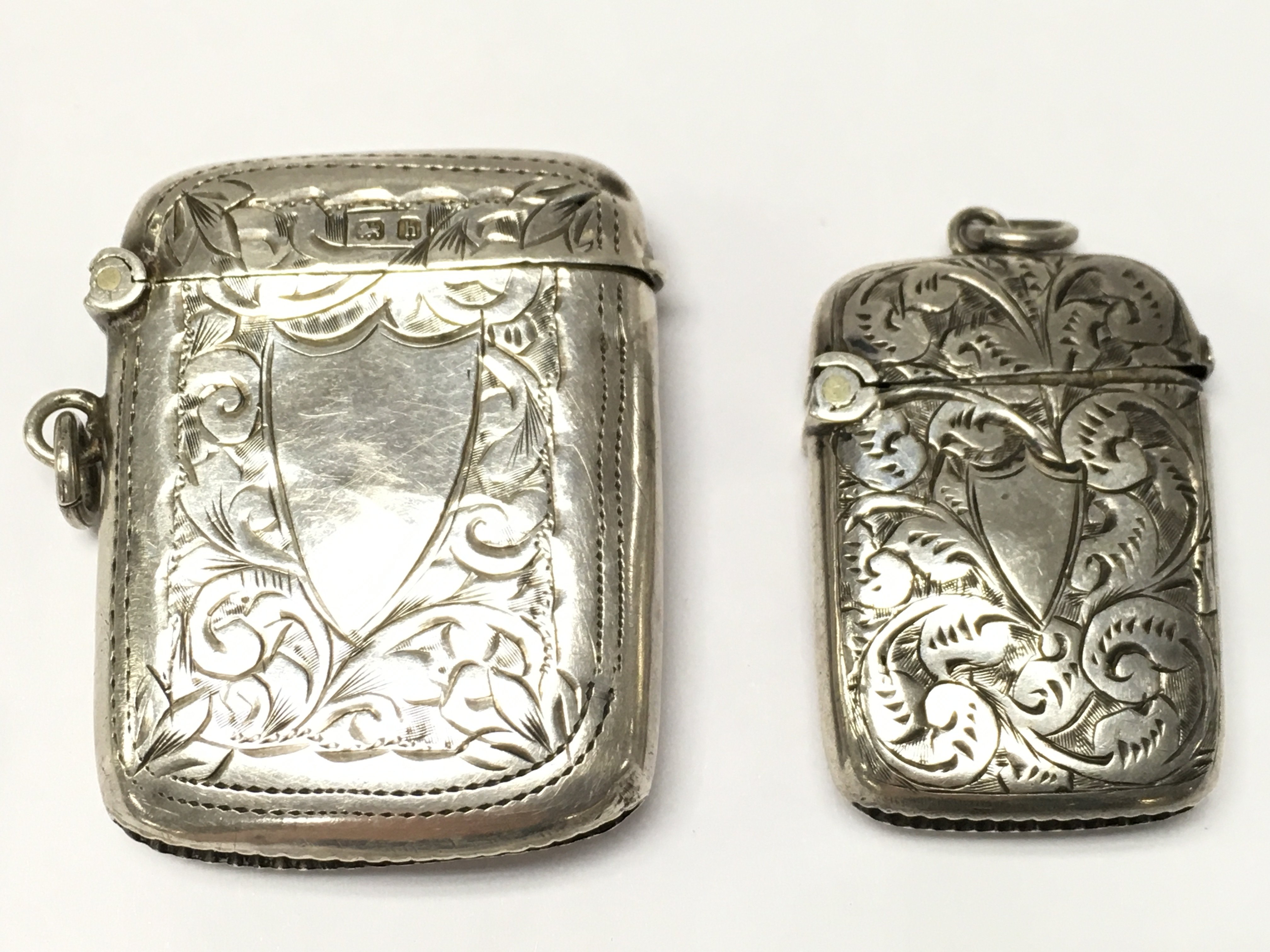Two silver hallmarked vestas , smallest vesta approximately 2.3cm wide 3.4cm tall. postage category A