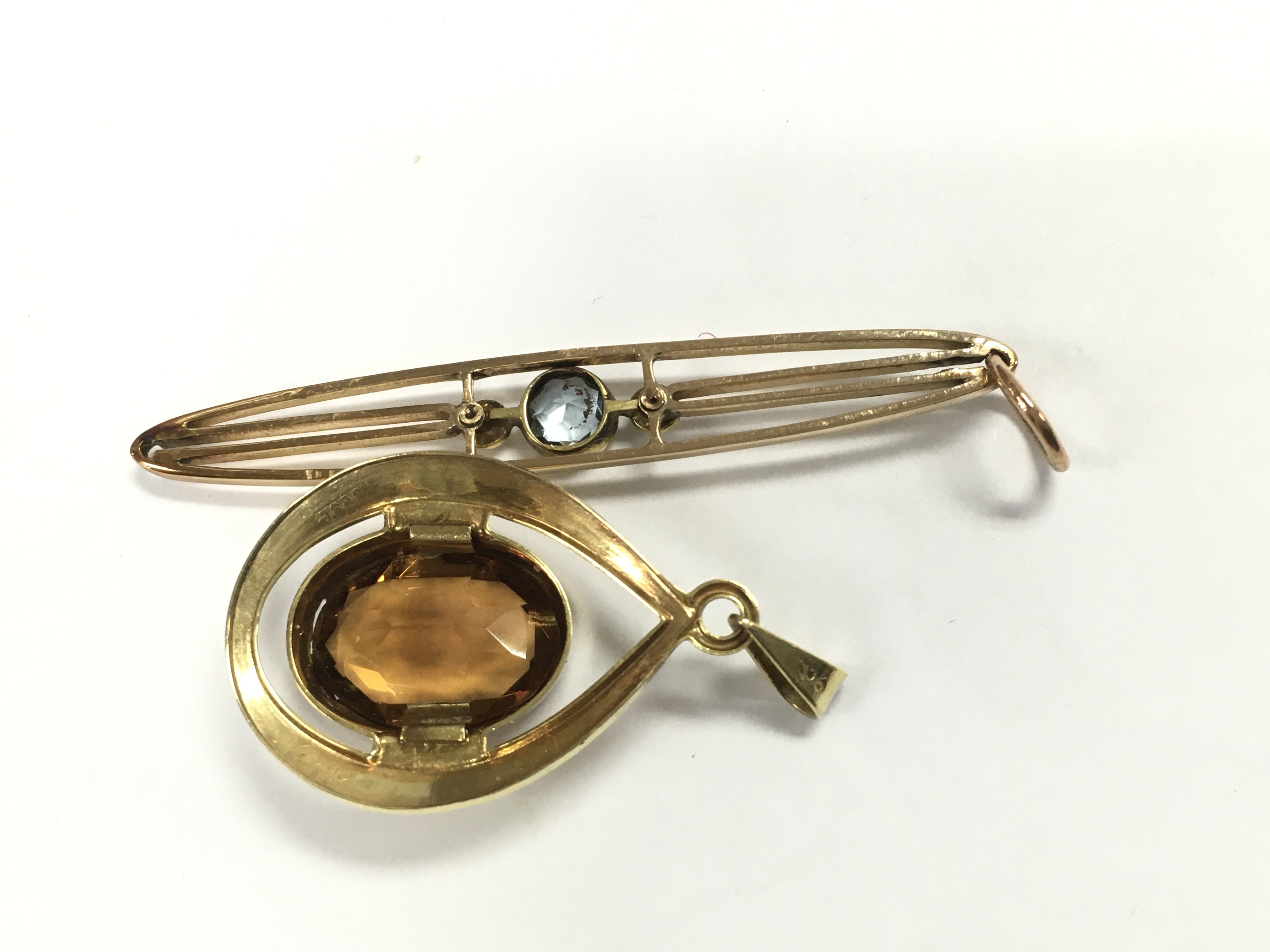 Two 9ct gold pendants 5g and one yellow metal pendant.