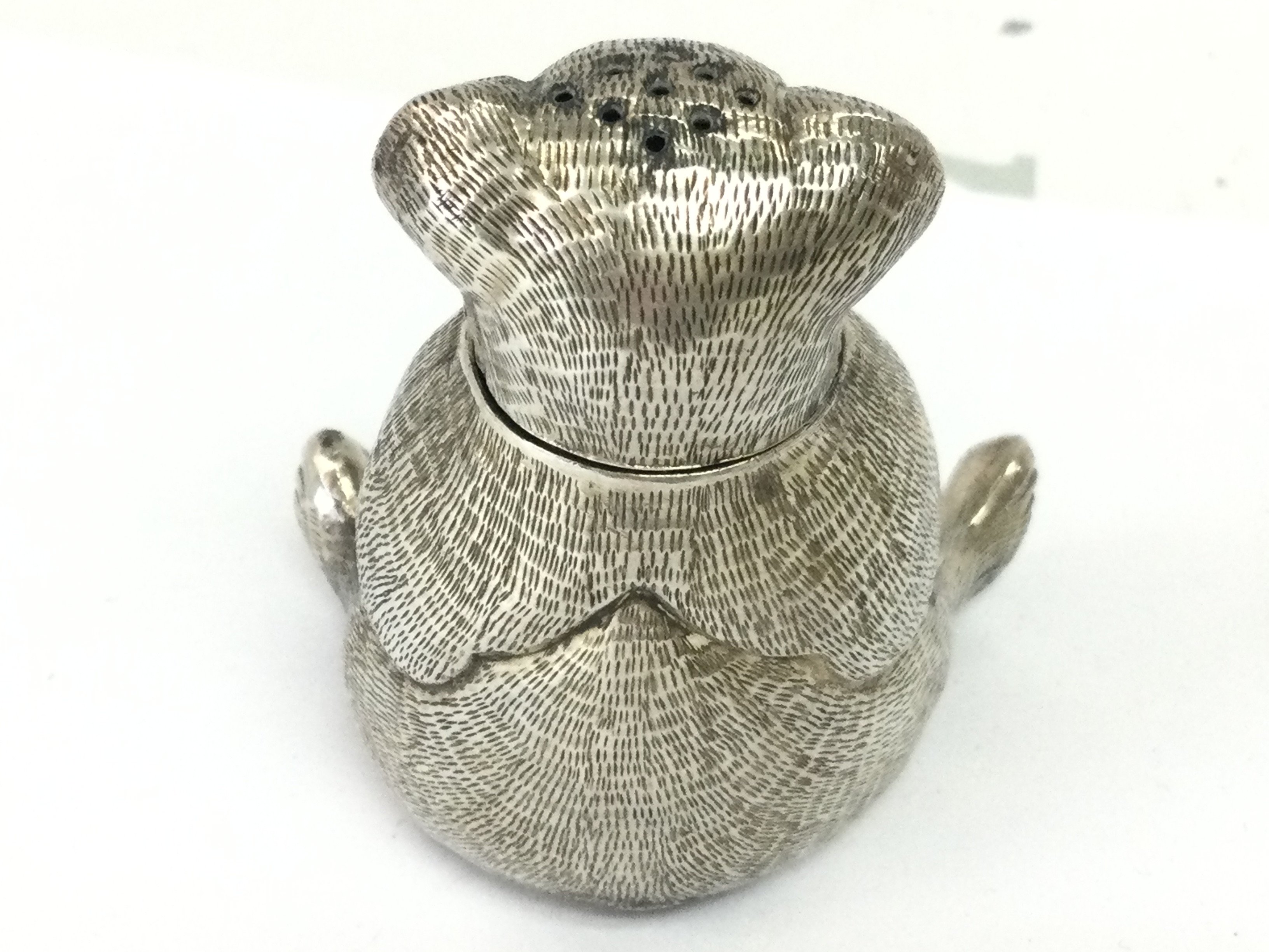 A Victorian novelty silver plated bear pepperette , 5cm tall. Postage category A. NO RESERVE