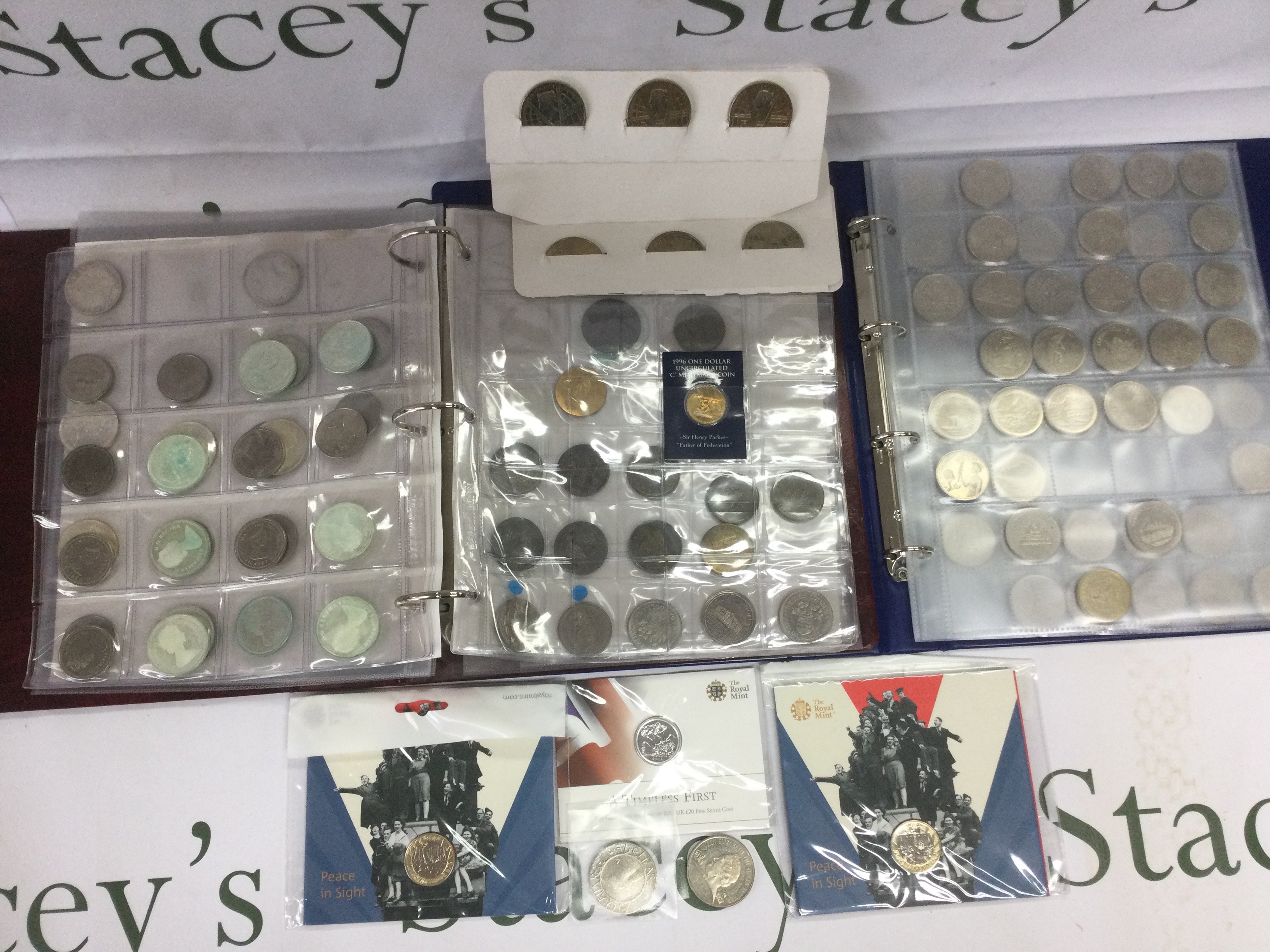 A collection of coins and banknotes, loose and in binders plus sealed proof sets. Shipping category D.