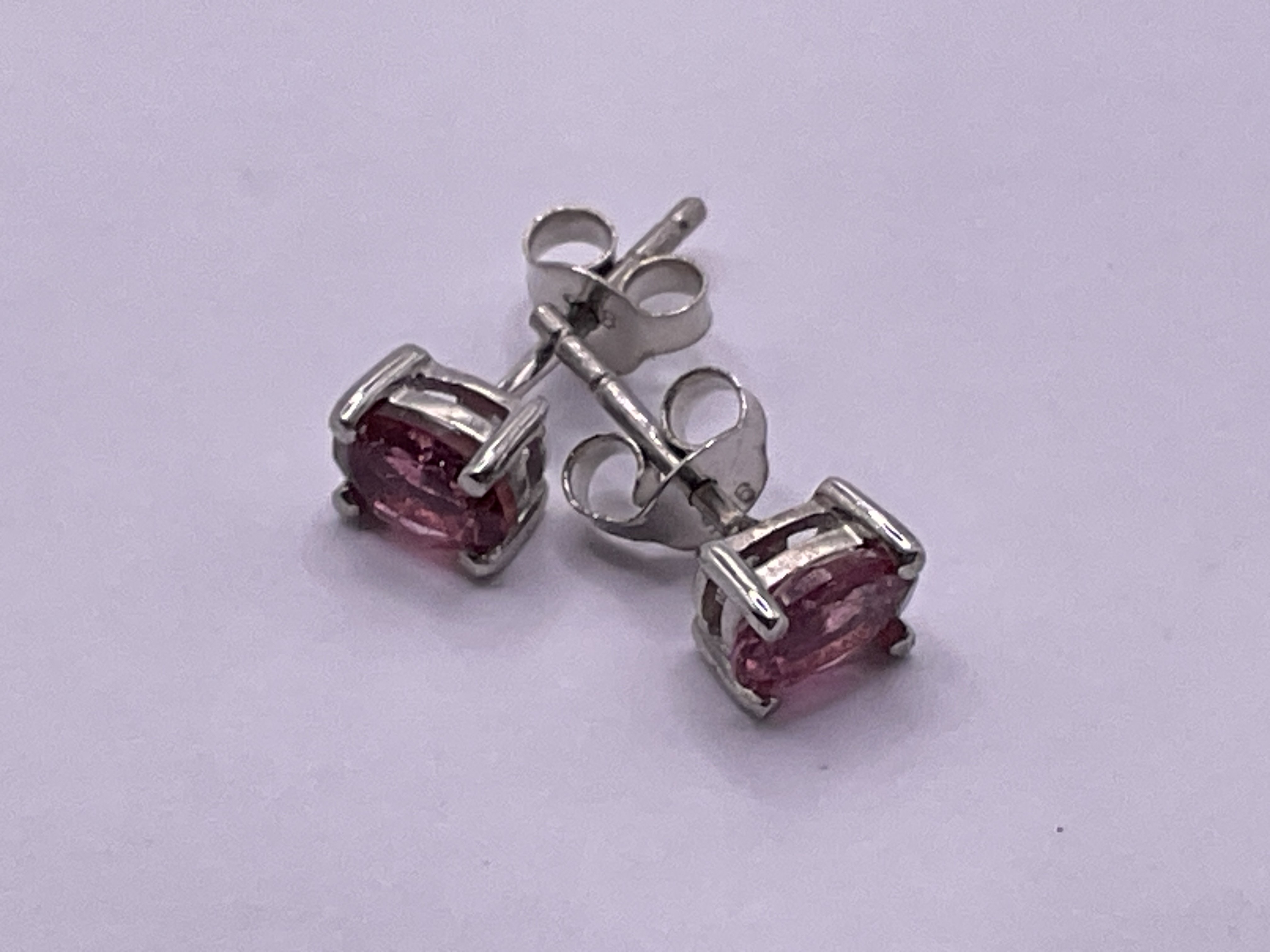 Pair of pink tourmaline studs in silver. Postage category A.