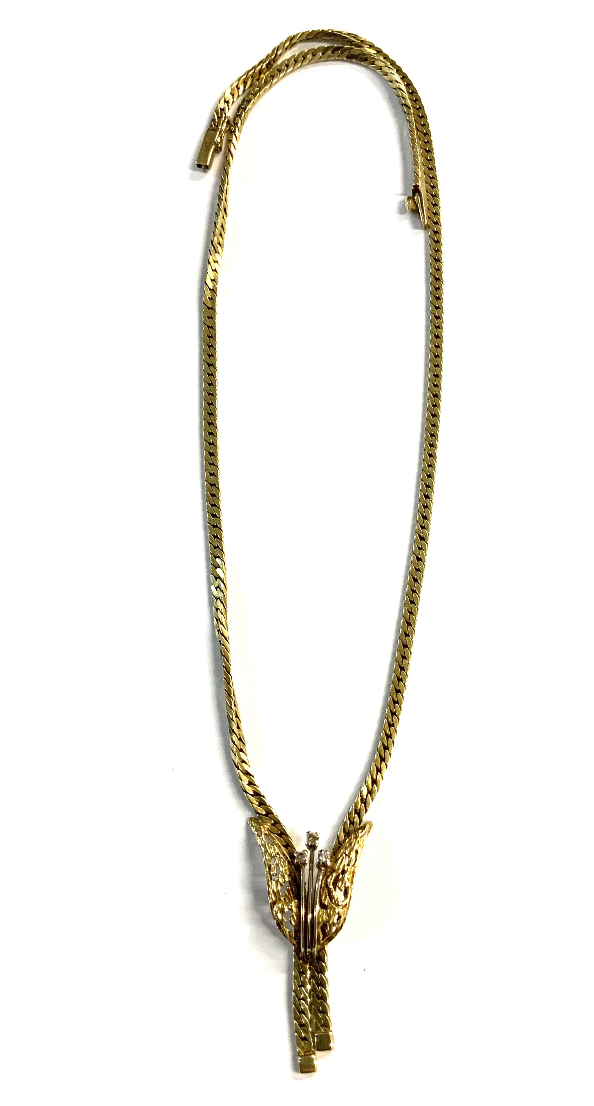 A modern design 14ct yellow gold hallmarked necklace the drop in the form of a flower with set with 3 small diamonds. 22.4g.