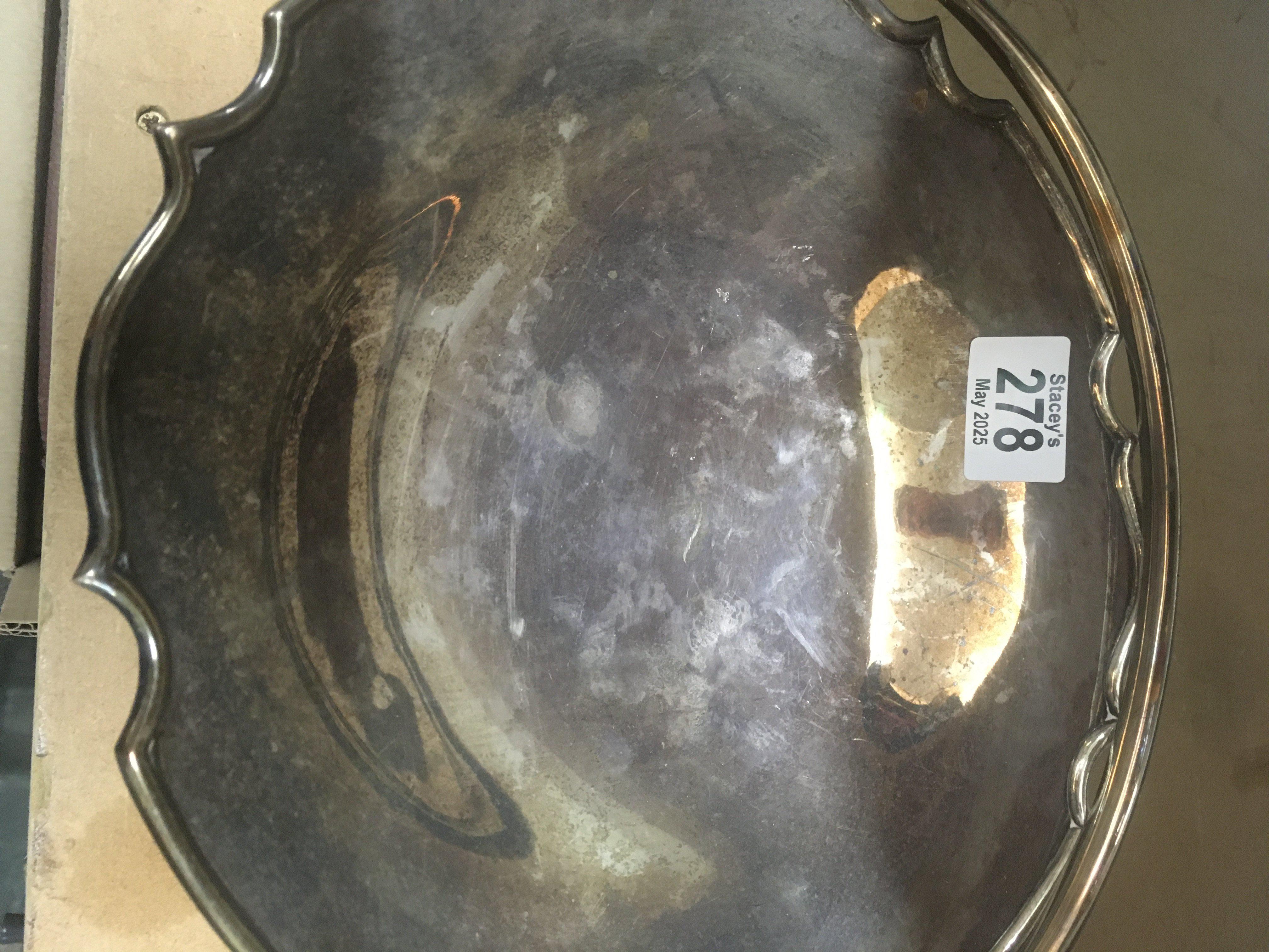 A silver swing handle basket 654 grams.