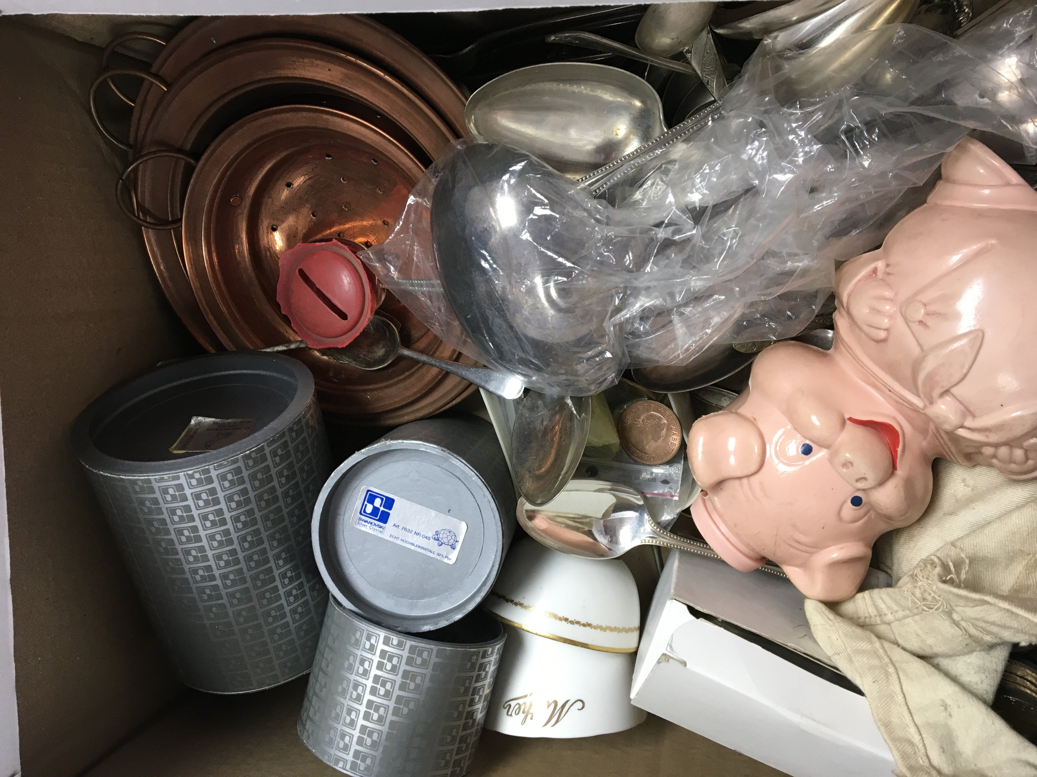 A box containing a large quantity of commemorative crowns other used circulated British coinage loose silver plated cutlery brass and copper ware and other oddments.