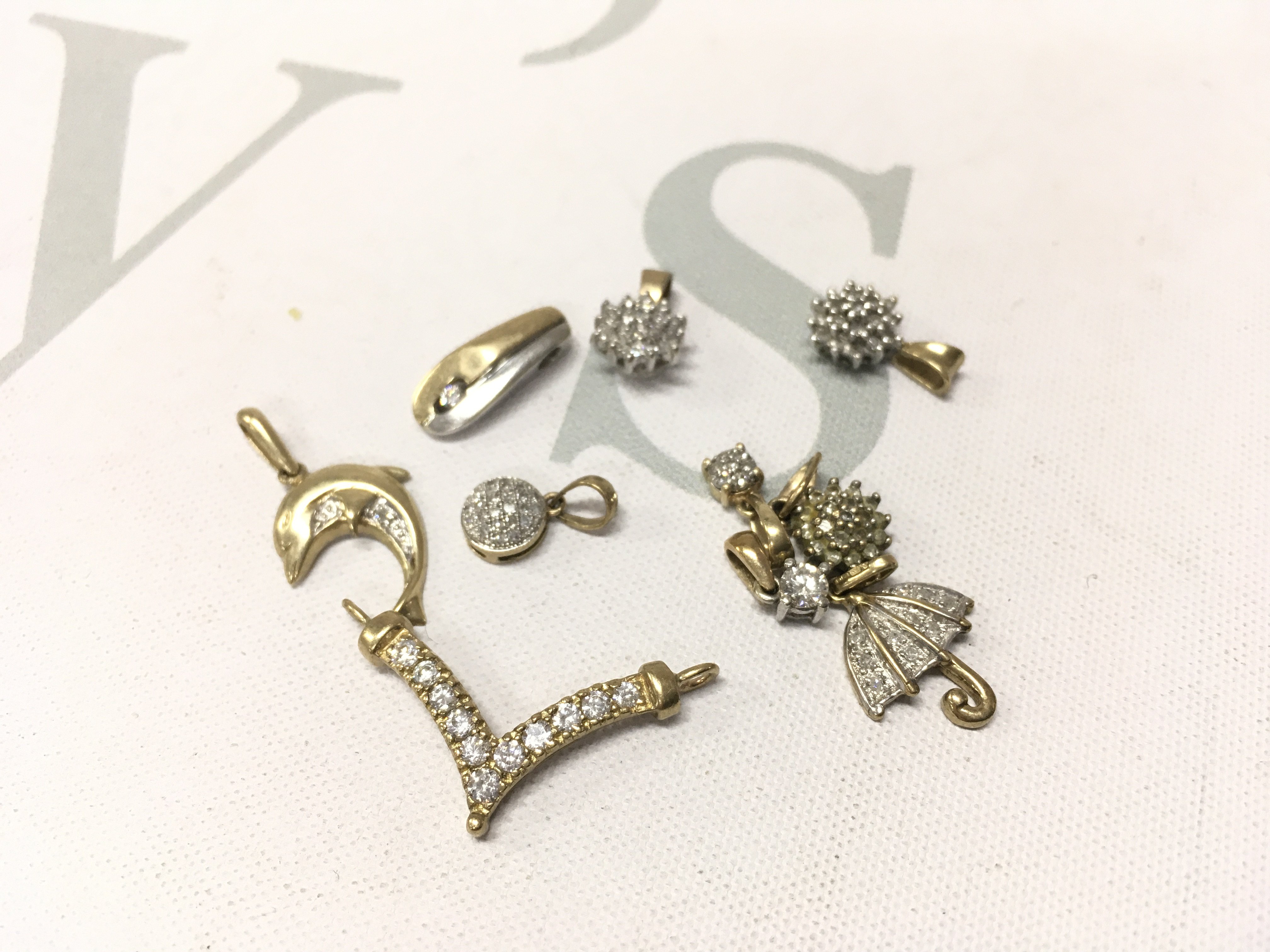 An assortment of stone set 9ct gold pendants. Approx weight 6.9grams.