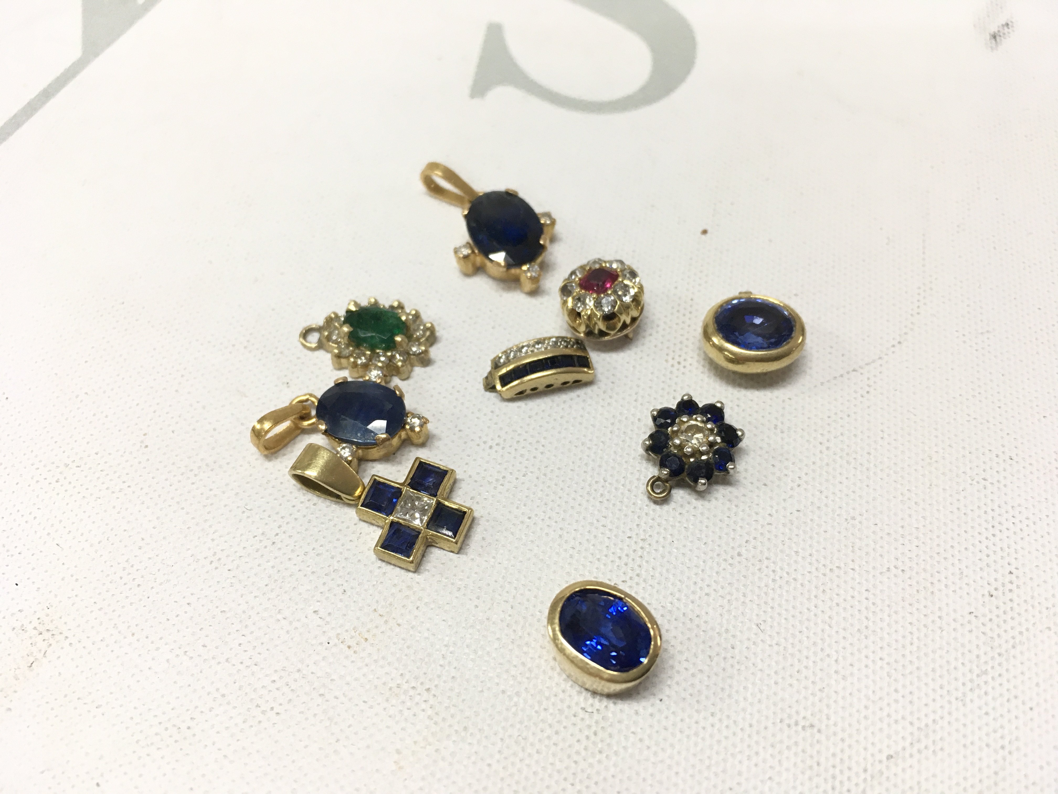 A mixed assortment of unmarked stone set pendants. Approx weight 12grams.