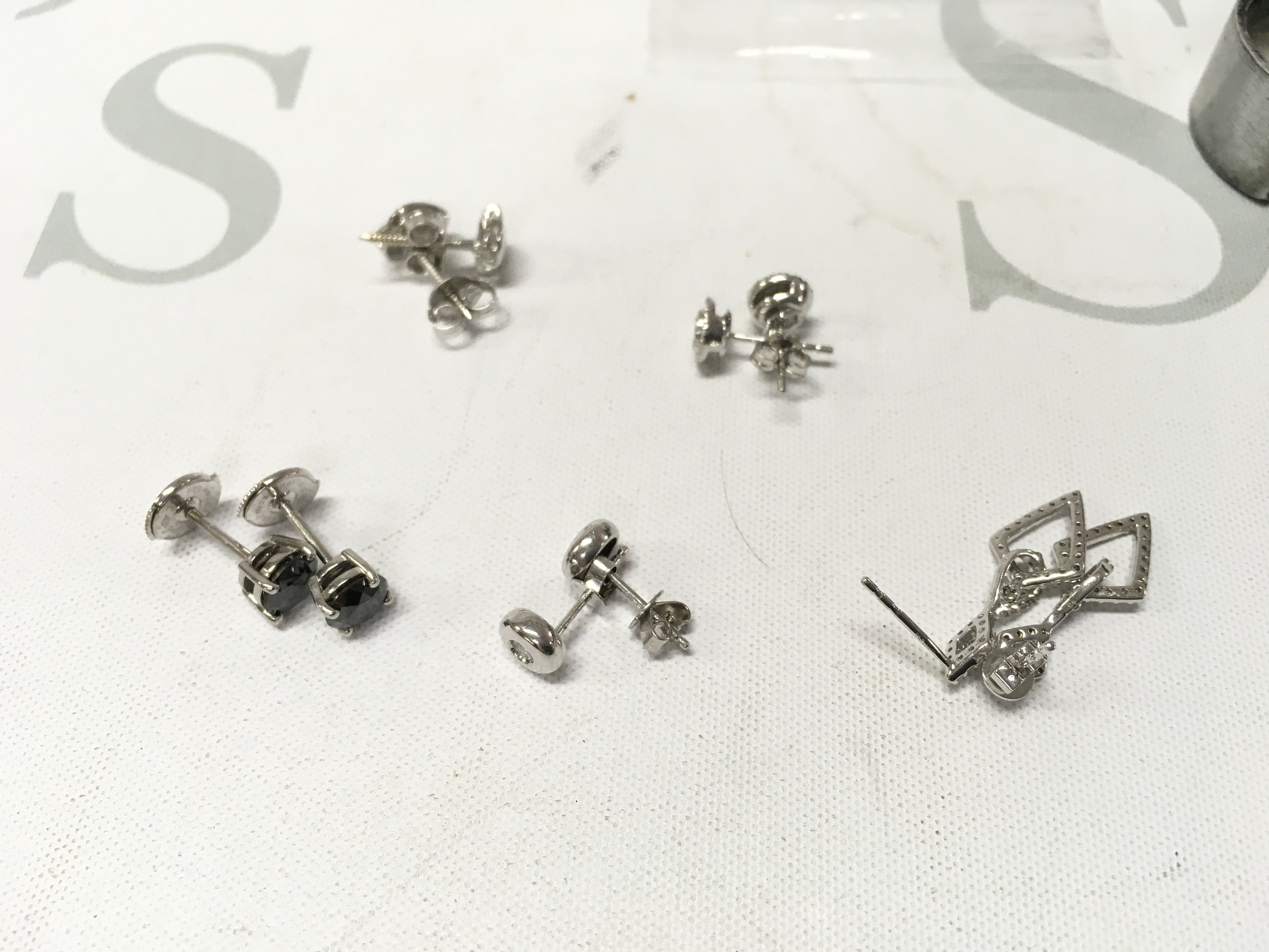 Five pairs of 18ct white gold studs. Approx weight 9.8grams.