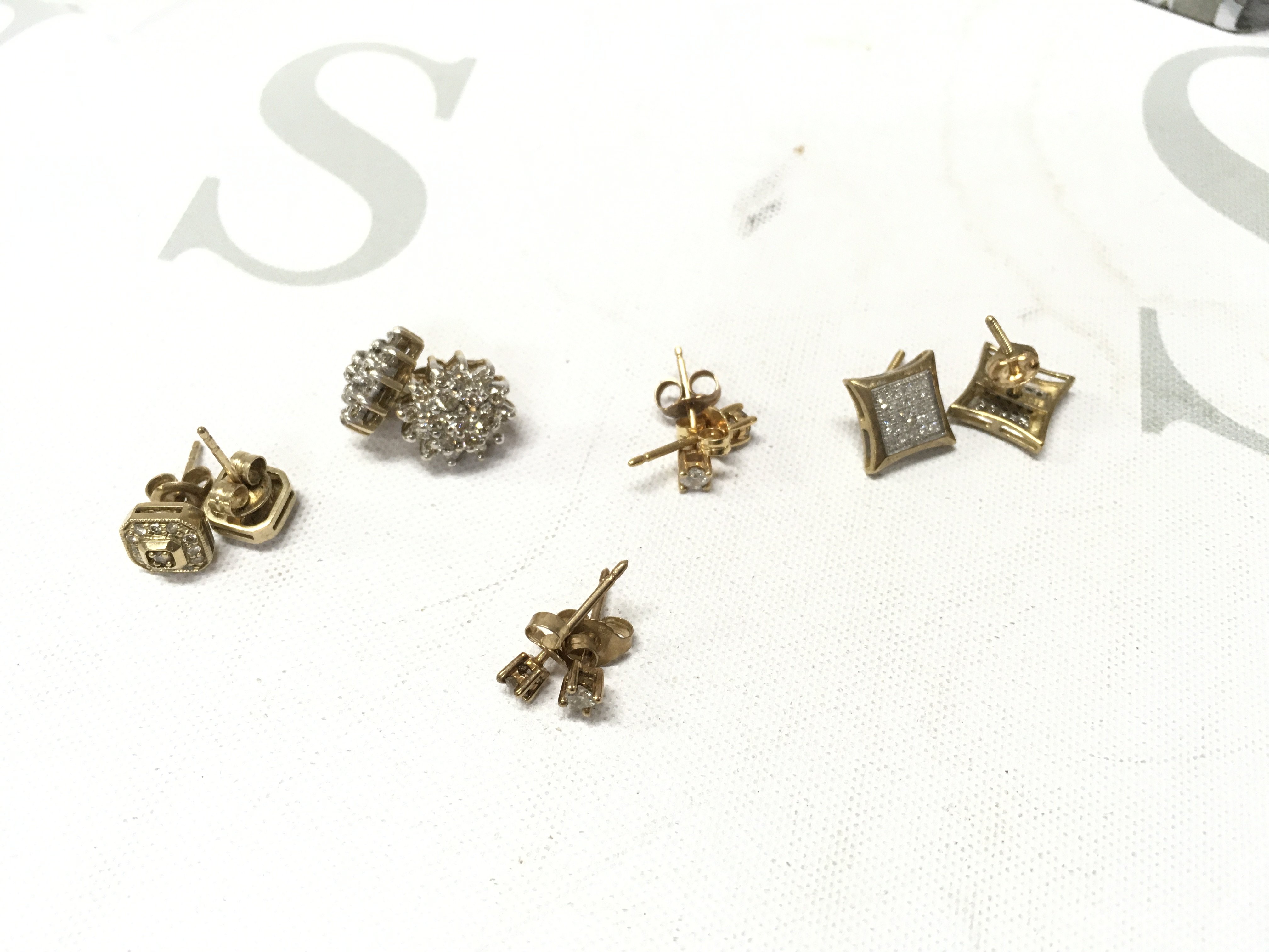 Five pairs of 9ct gold stone set studs. Approx weight 6.7 grams.