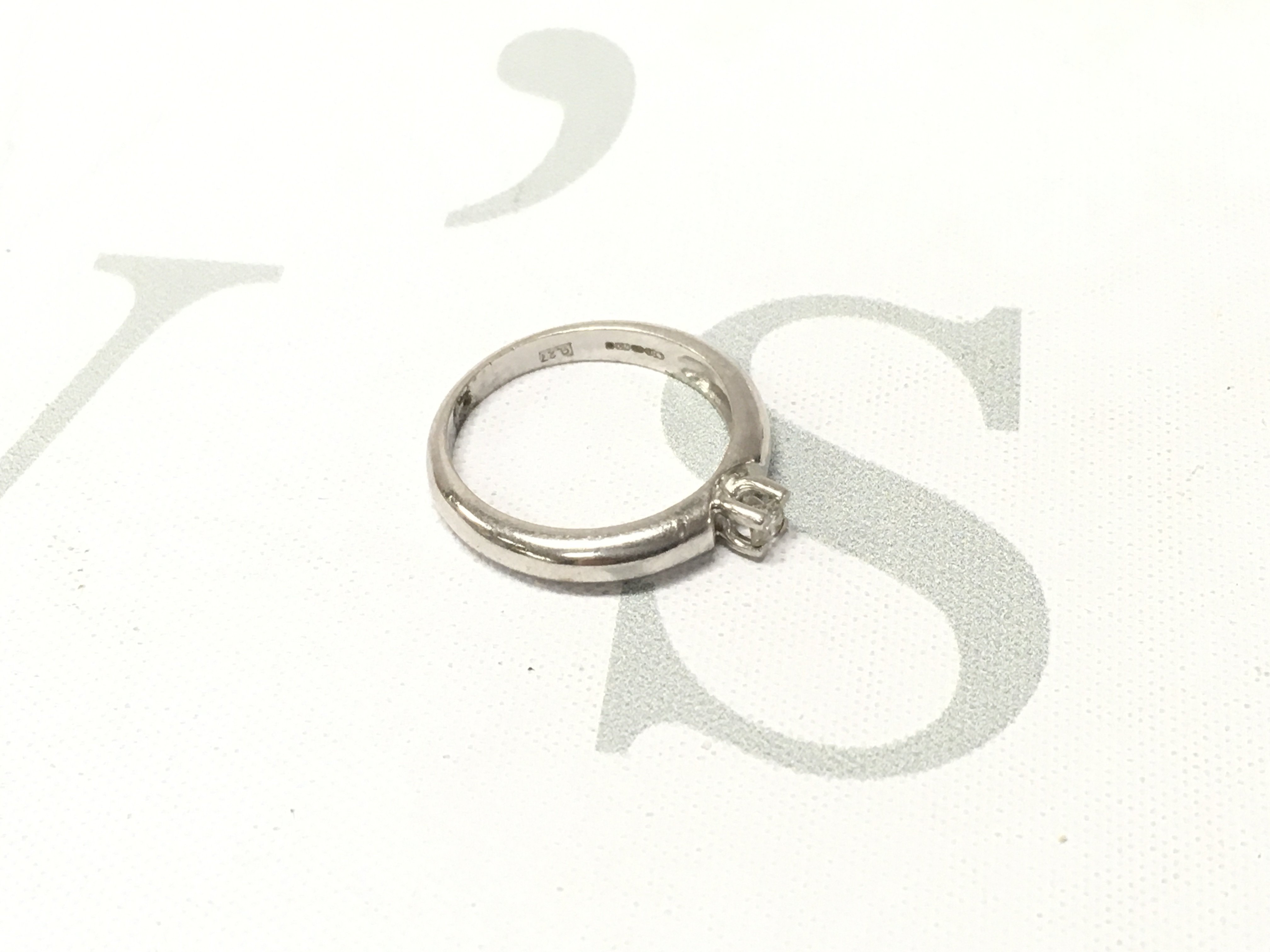 An 18ct white gold solitaire ring. Approx weight 4.4 grams, Approx size N 1/2.