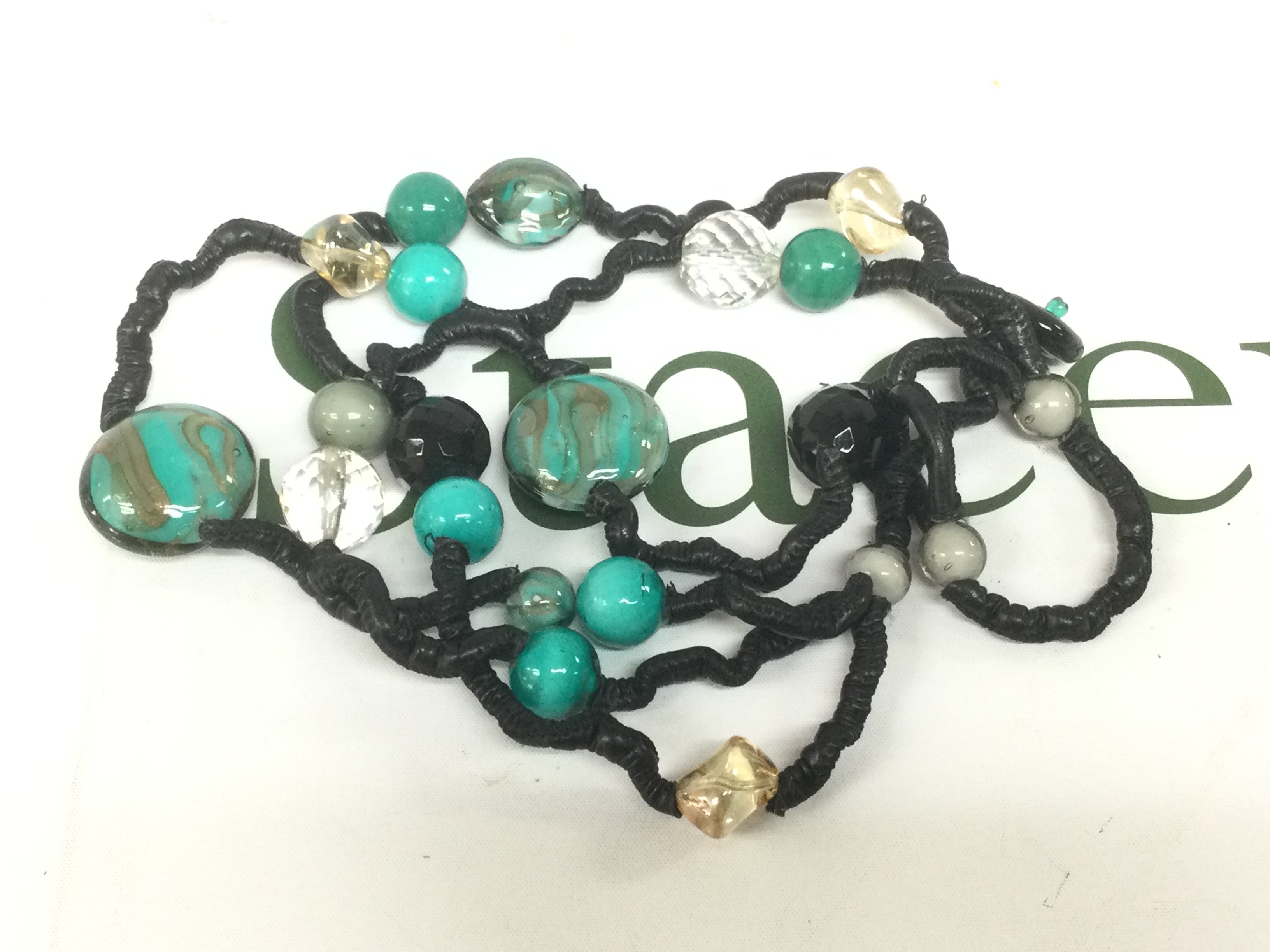 A Michael Kors glass bead necklace. Shipping category A.