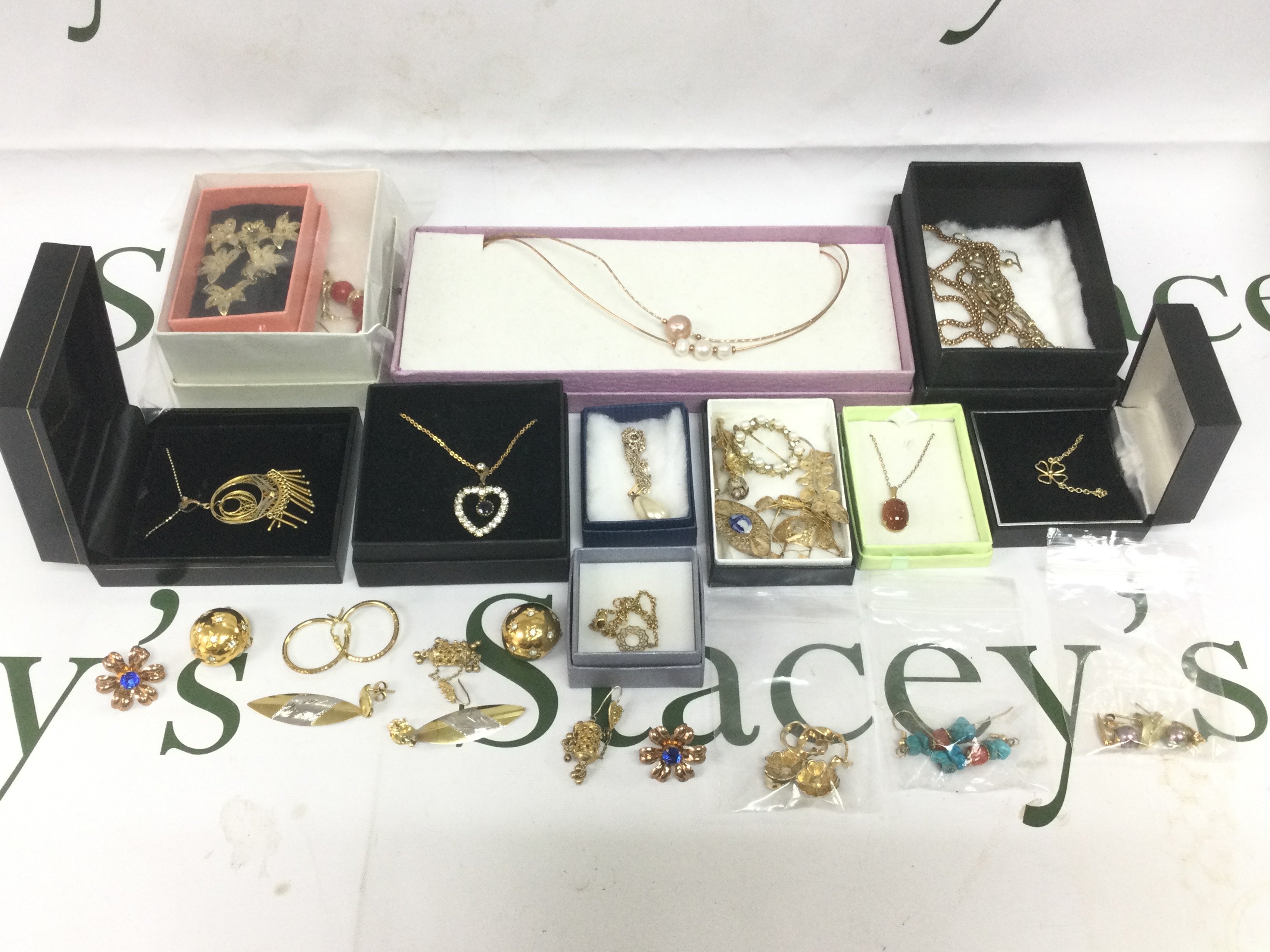 A collection of silver gilt jewellery comprising brooches, necklaces, earrings etc. Shipping category B.
