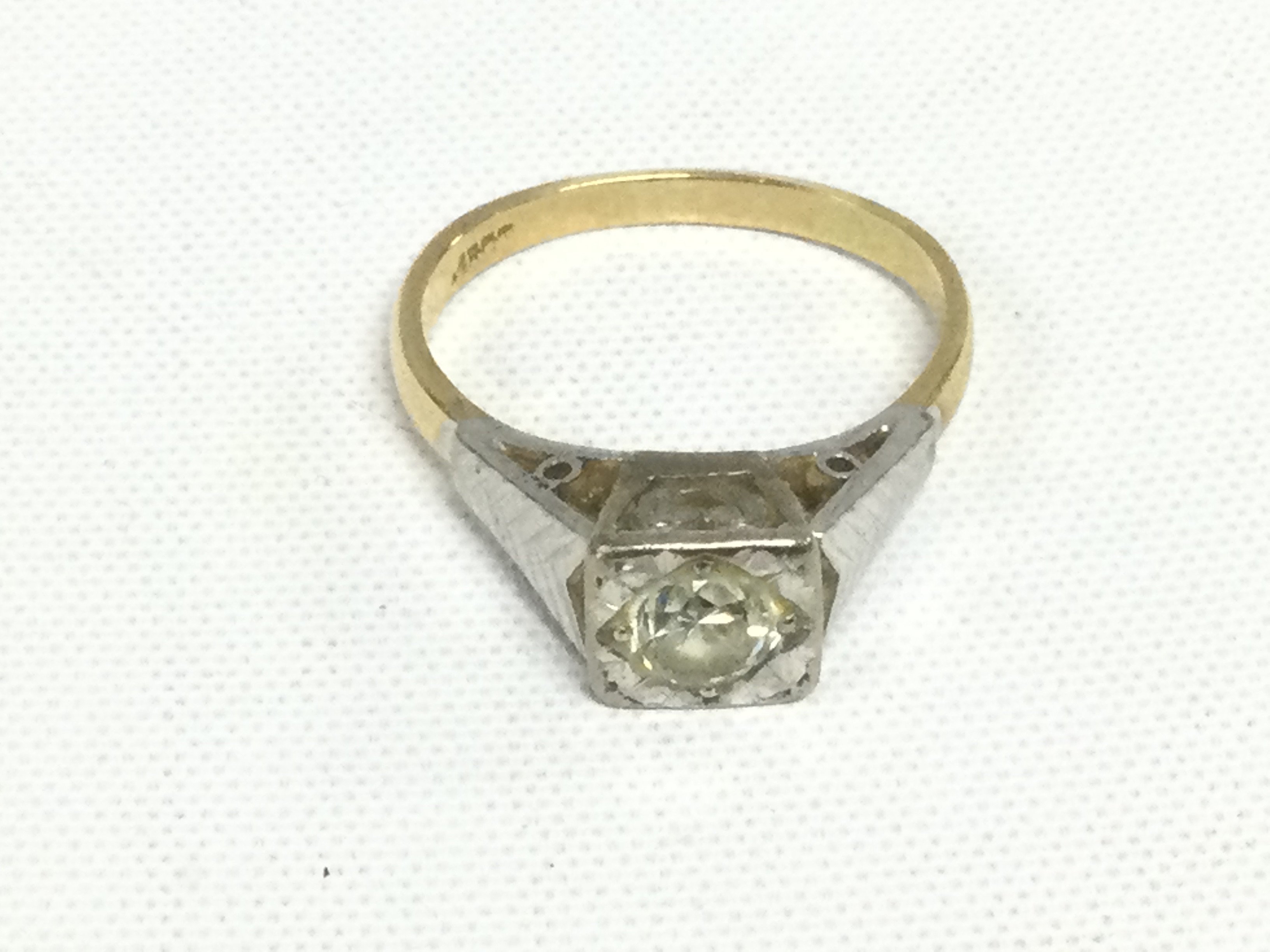 An 18ct gold diamond solitaire ring, approx 4.1g and approx size I. Shipping category A.
