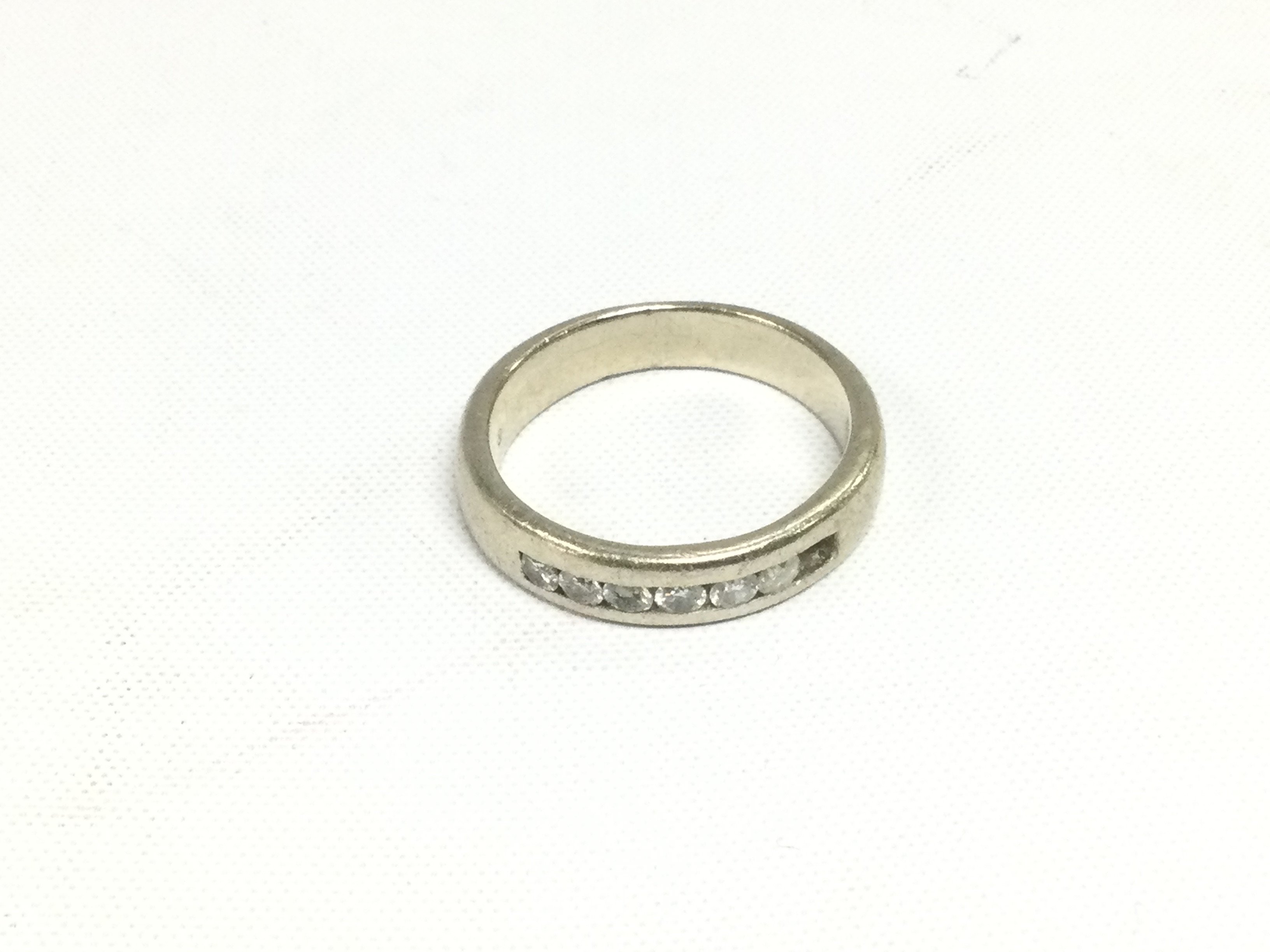 A 14k gold half eternity diamond ring, one stone missing, approx 7.8g and approx size U. Shipping category A.