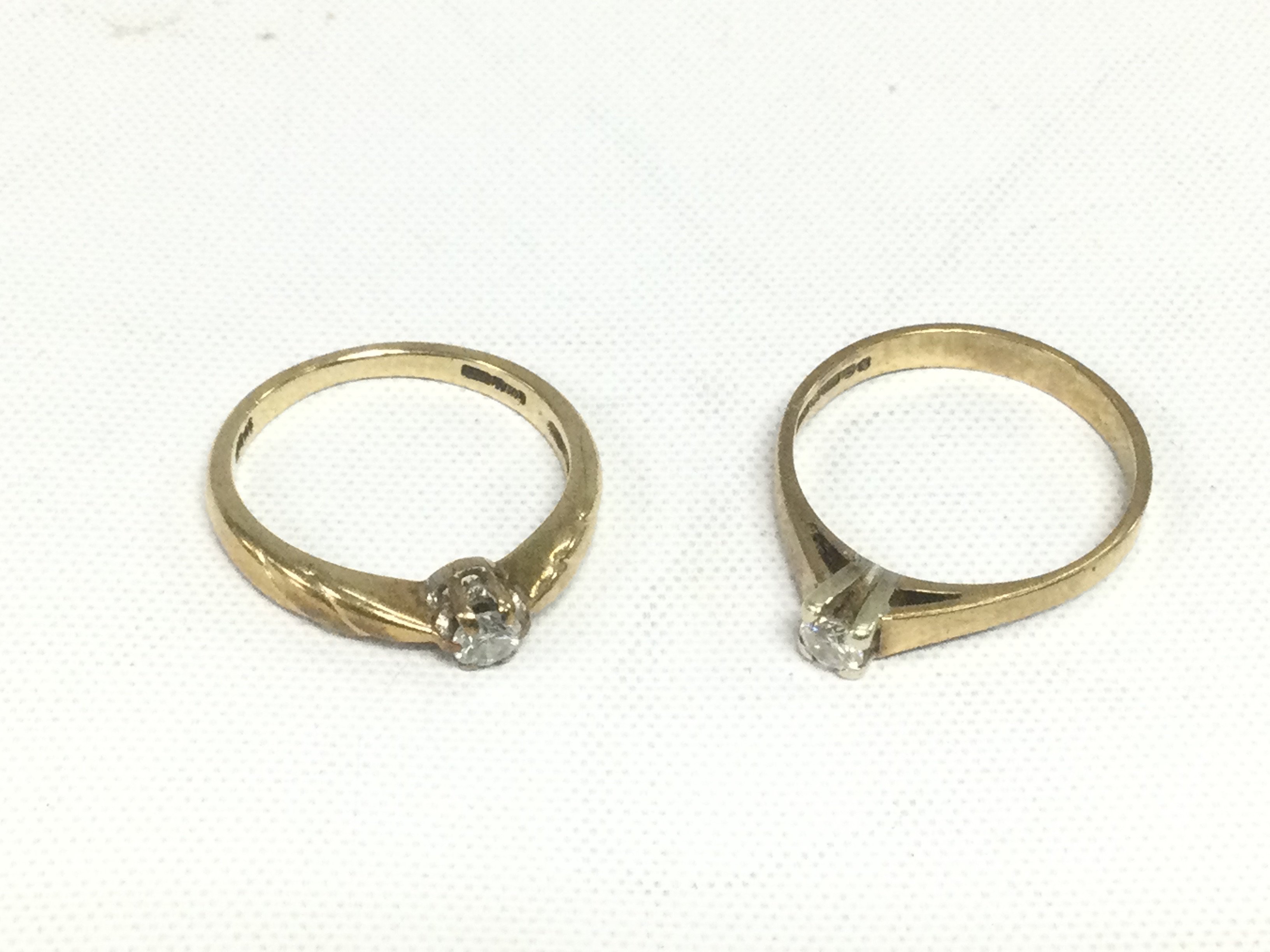 Two 9ct gold solitaire diamond rings, total approx weight 3.9g and approx sizes L and M. Shipping category A.