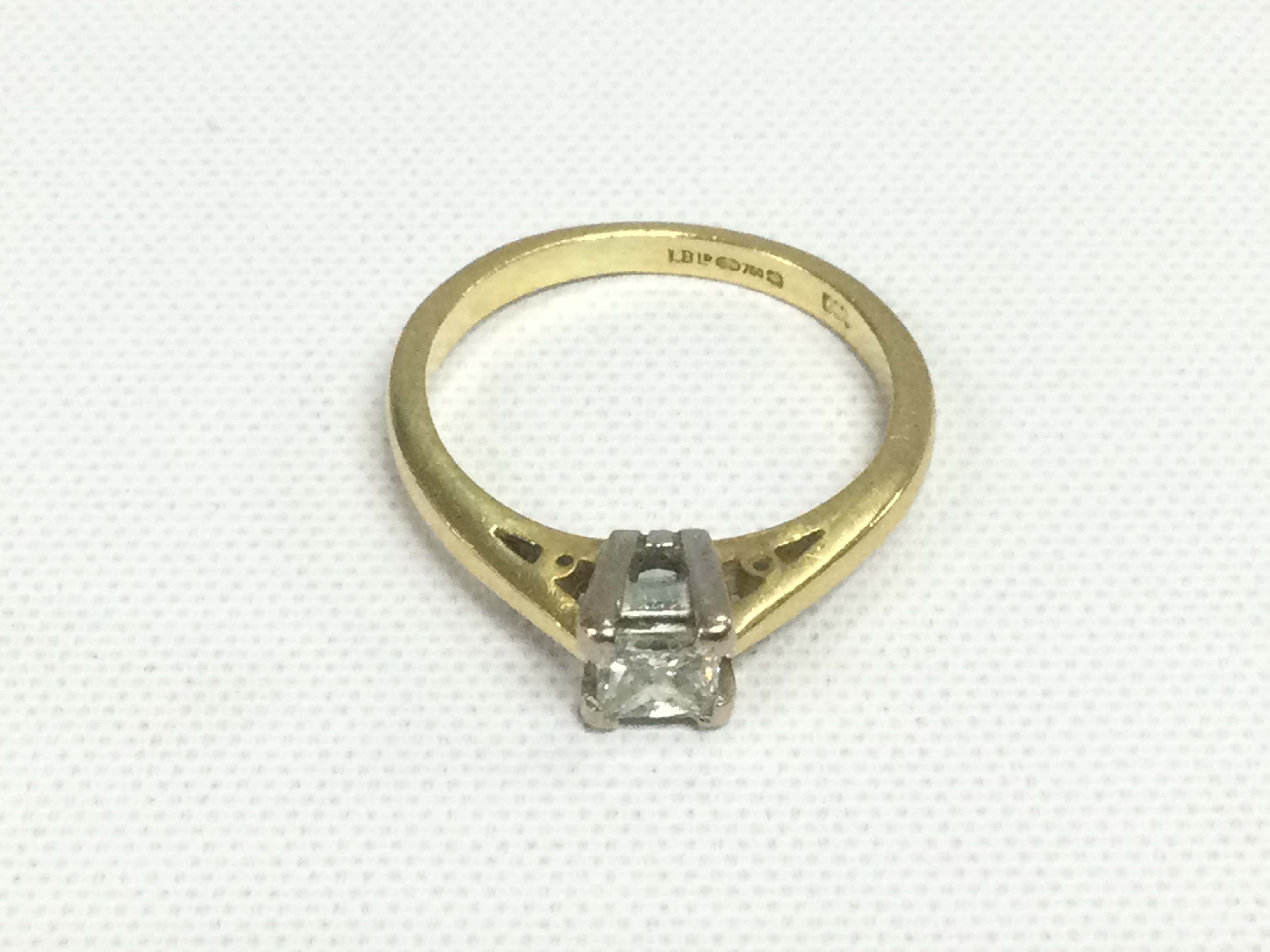 An 18ct gold solitaire diamond ring, approx 2.4g and approx size H. Shipping category A.