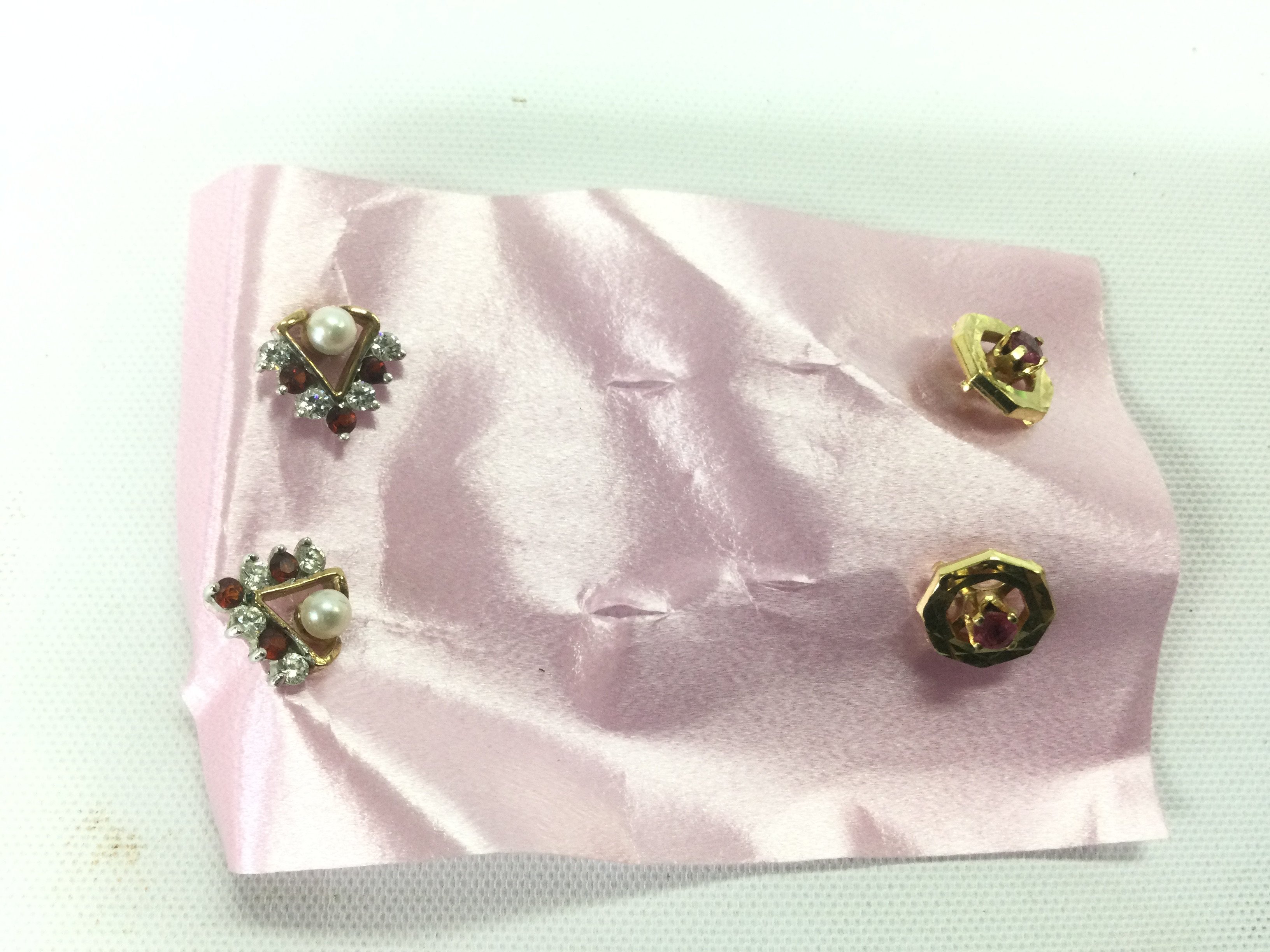 Two pairs of 9ct gold, diamond and ruby earrings, approx 2.9g. Shipping category A.