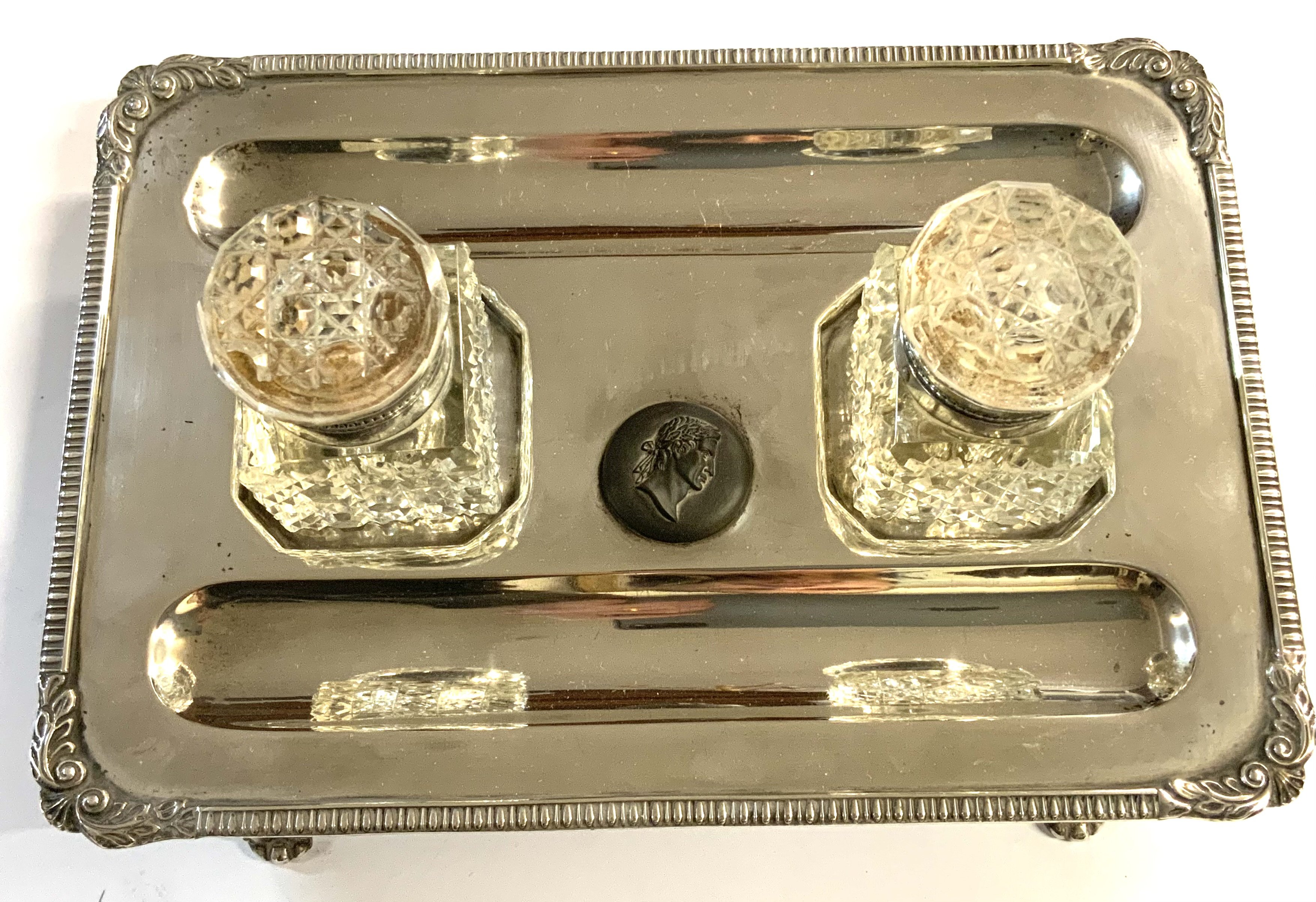 A hallmarked silver desk stand with marks for London 1897, with a pair of later added silver plated and glass inkwells and a silver Yard-O-Led pencil. (A)