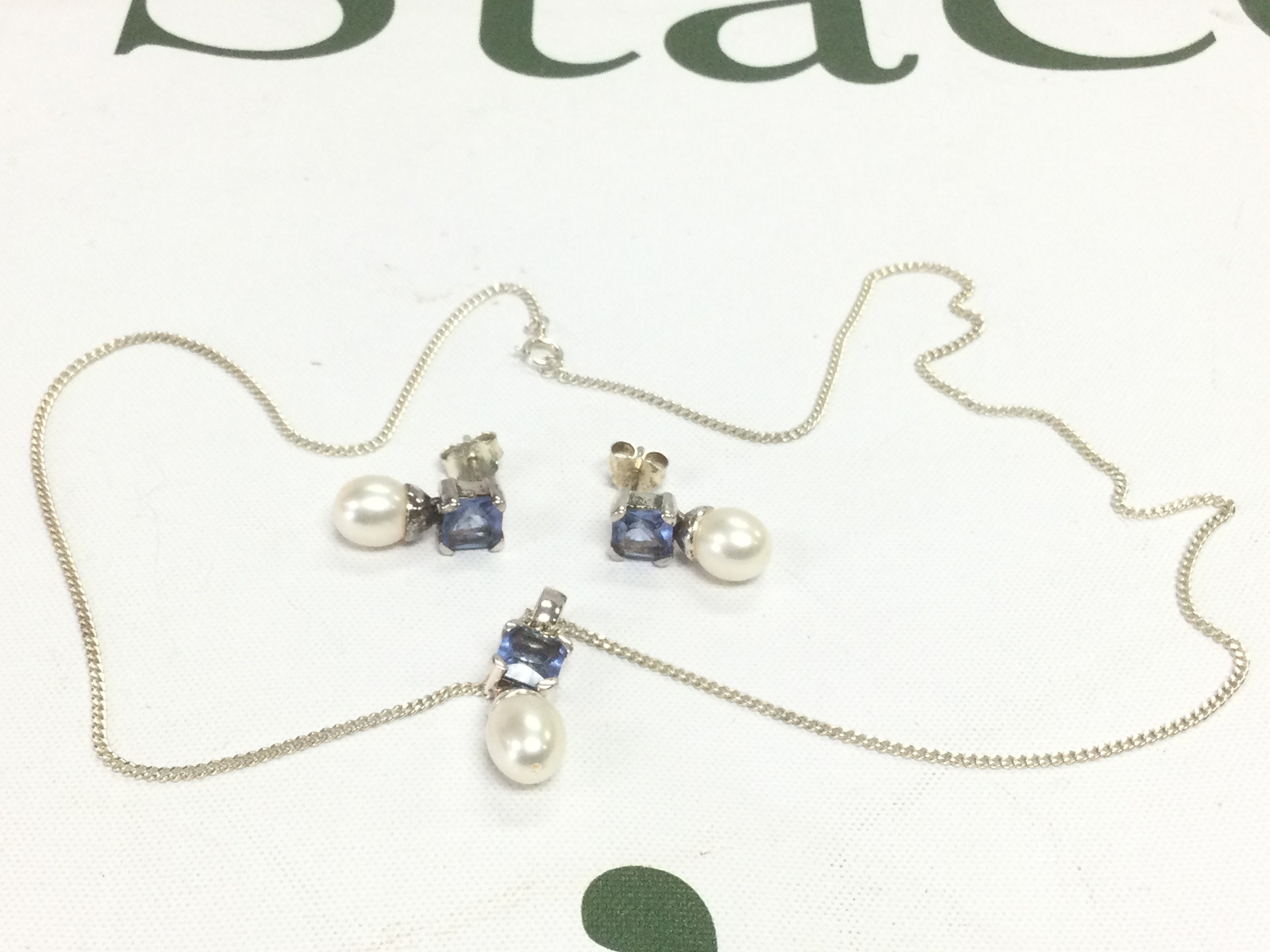 A silver and stone set suite of jewellery. Shipping category A.