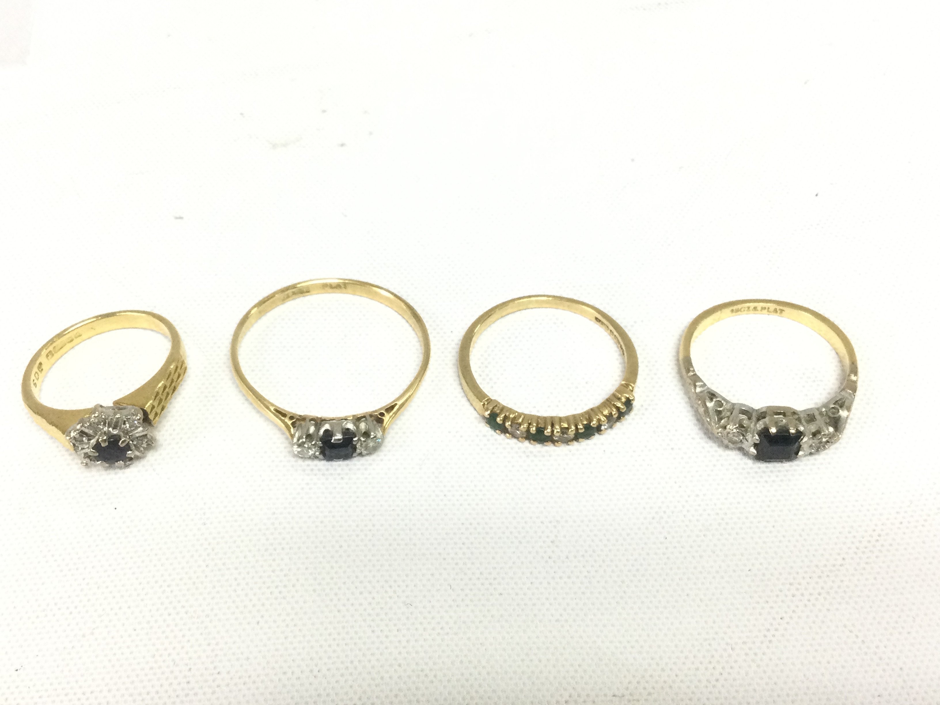 Four 18ct gold rings set with sapphires and diamonds, approx total weight 10.3g and approx sizes K, U, F and M. Shipping category A.