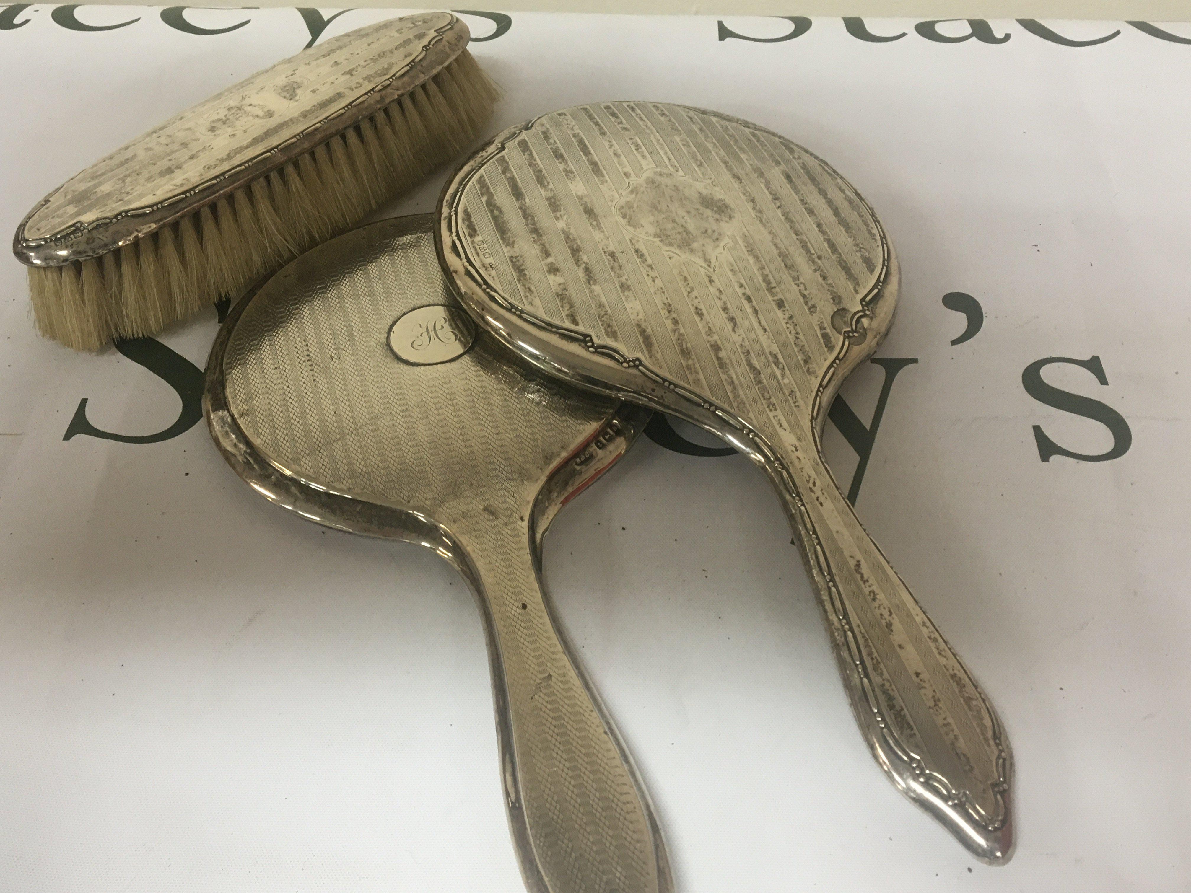 Two Silver backed mirrors and a brush (3)