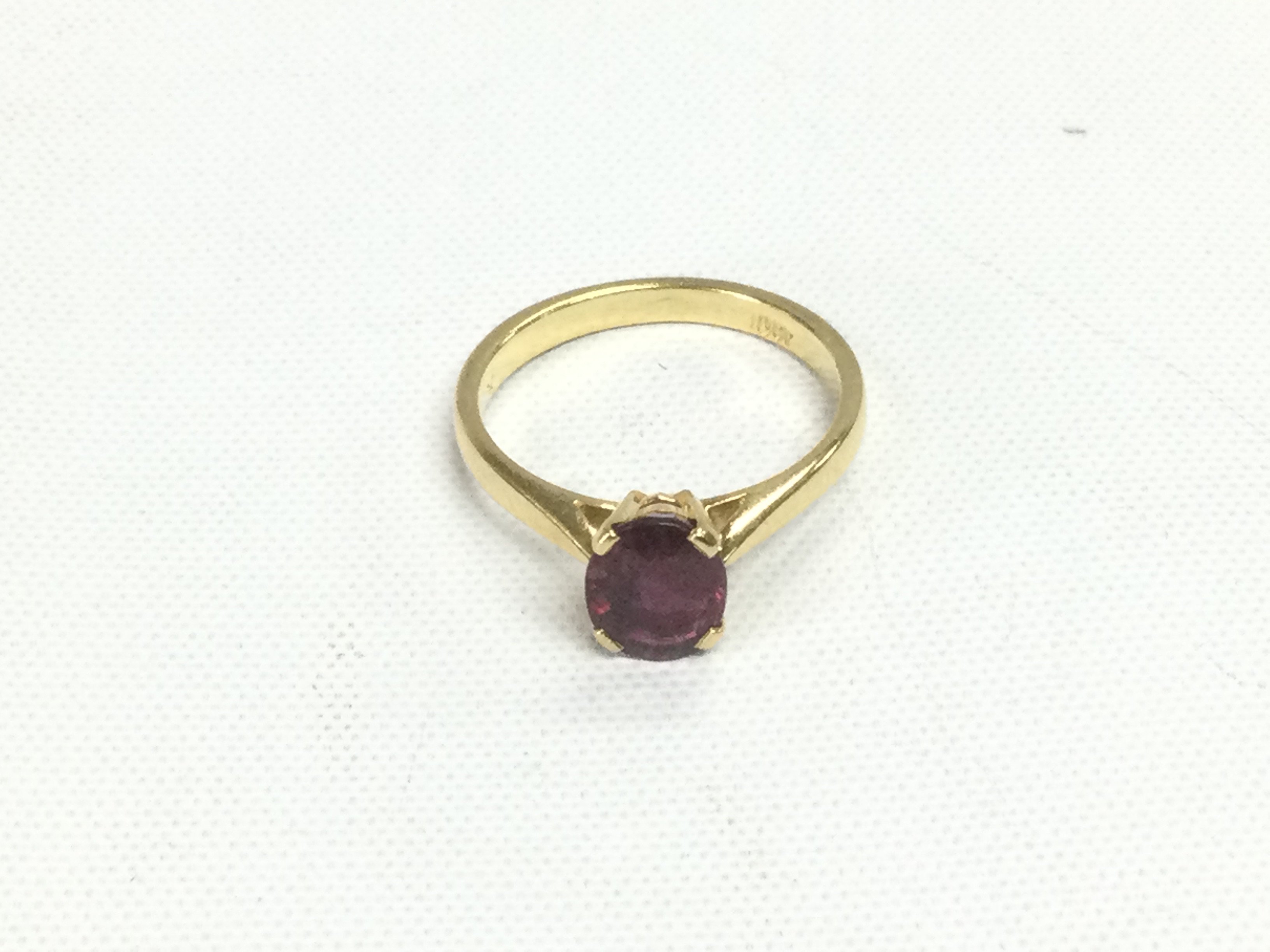 An 18ct gold ruby solitaire ring, approx 1.19ct, approx 2.8g and approx size J. Shipping category A.