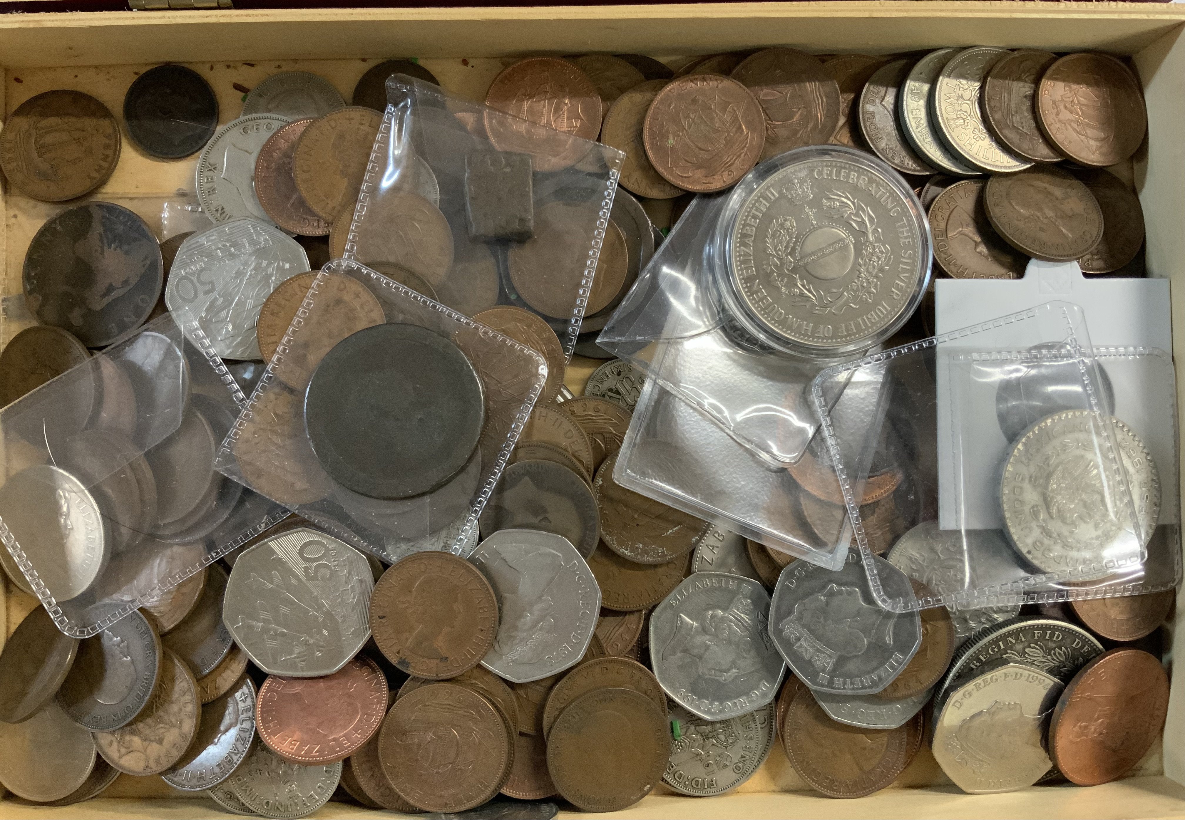 A box of mixed world coins. (A)