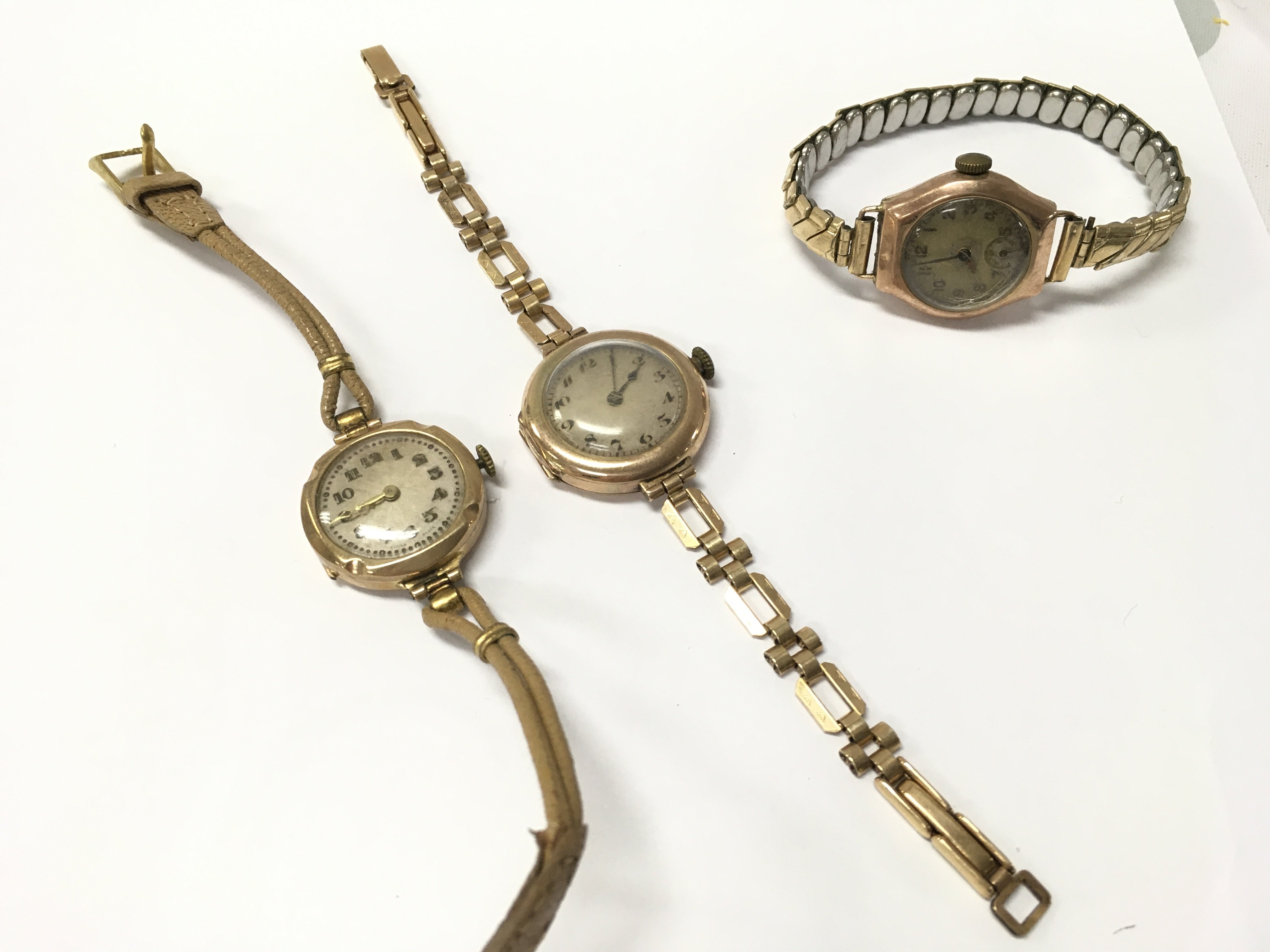 9ct gold ladies watches with stainless steel, leather, rolled gold straps. 50.4g total weight . Postage category A