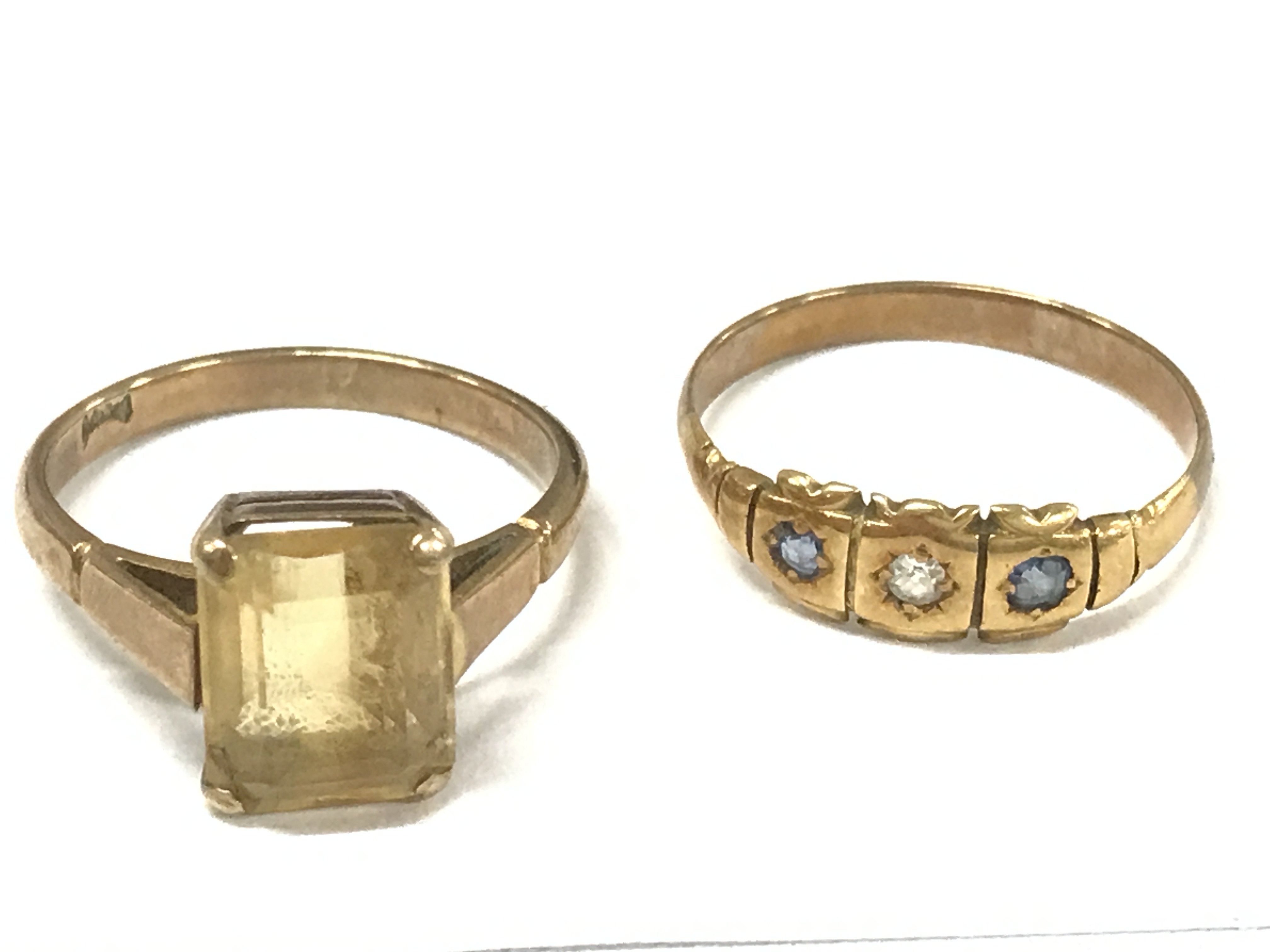 Two unmarked gold rings , 4.9g total weight. Postage cat A