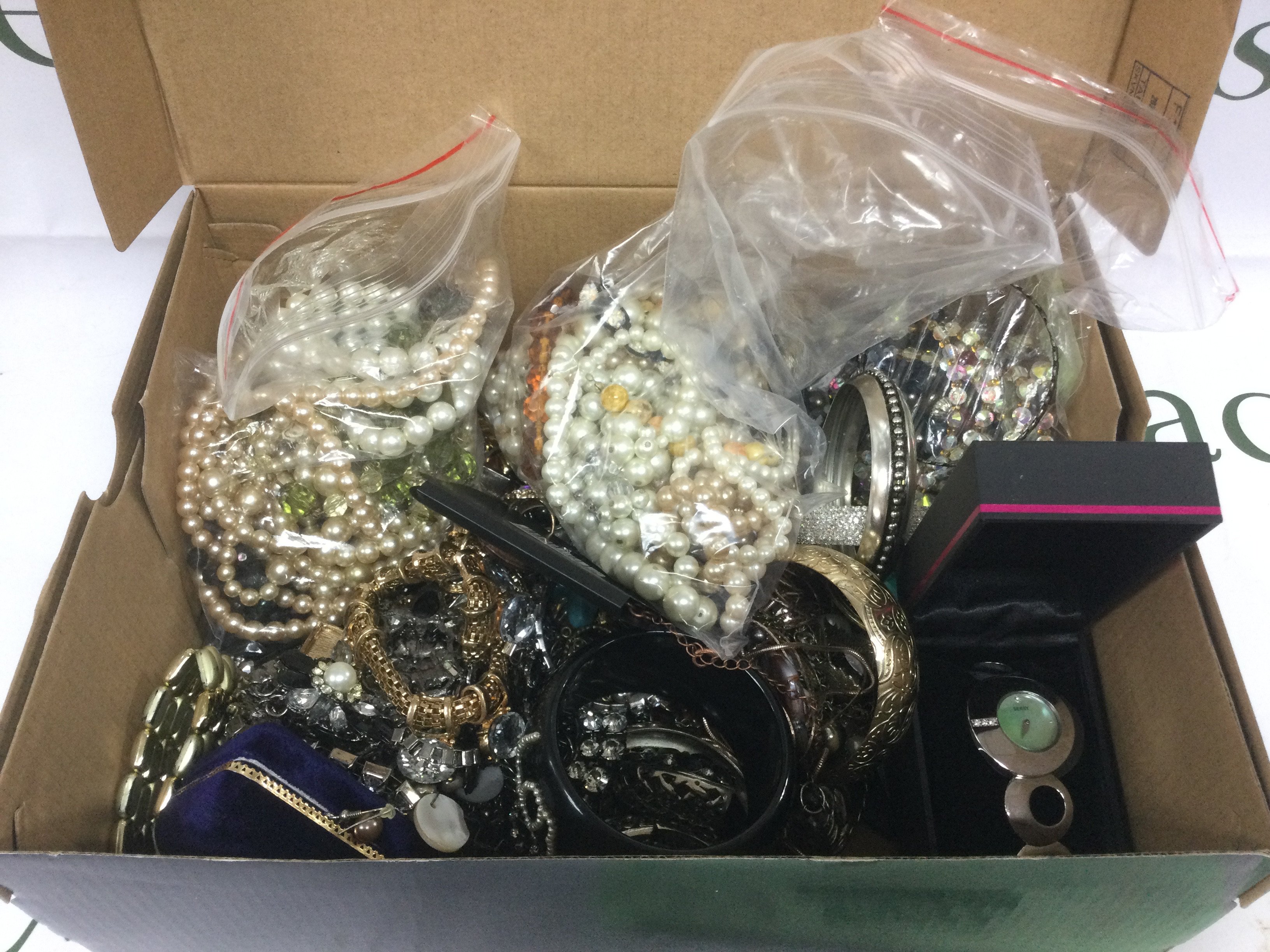 A box of costume jewellery. Shipping category C.