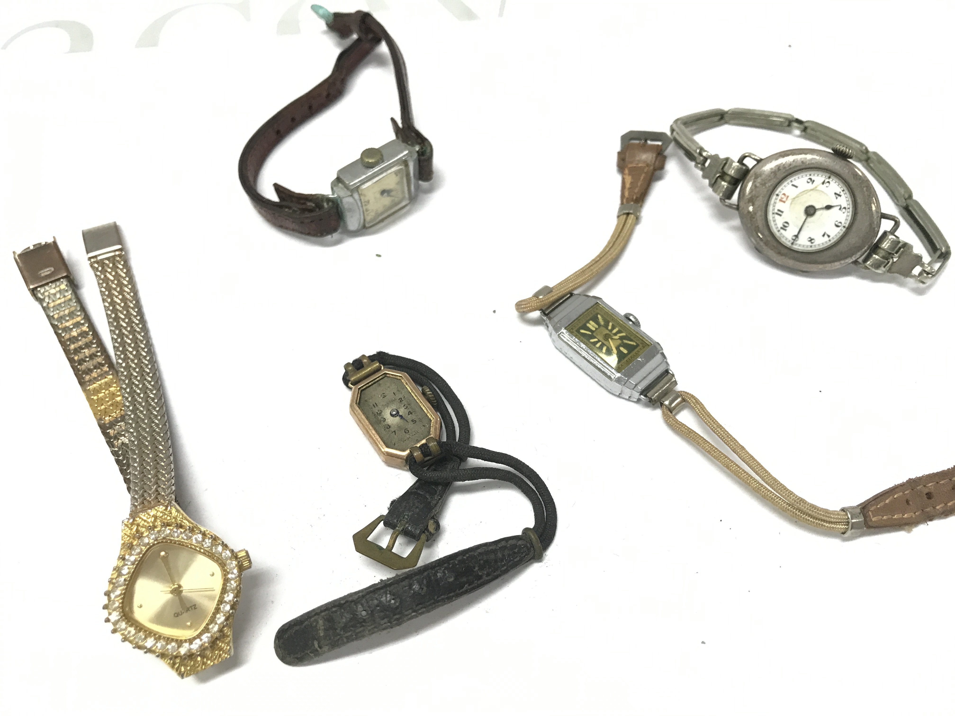 A collection of Dress watches including a silver cased watch and a 9ct gold cased watch. Postage cat A