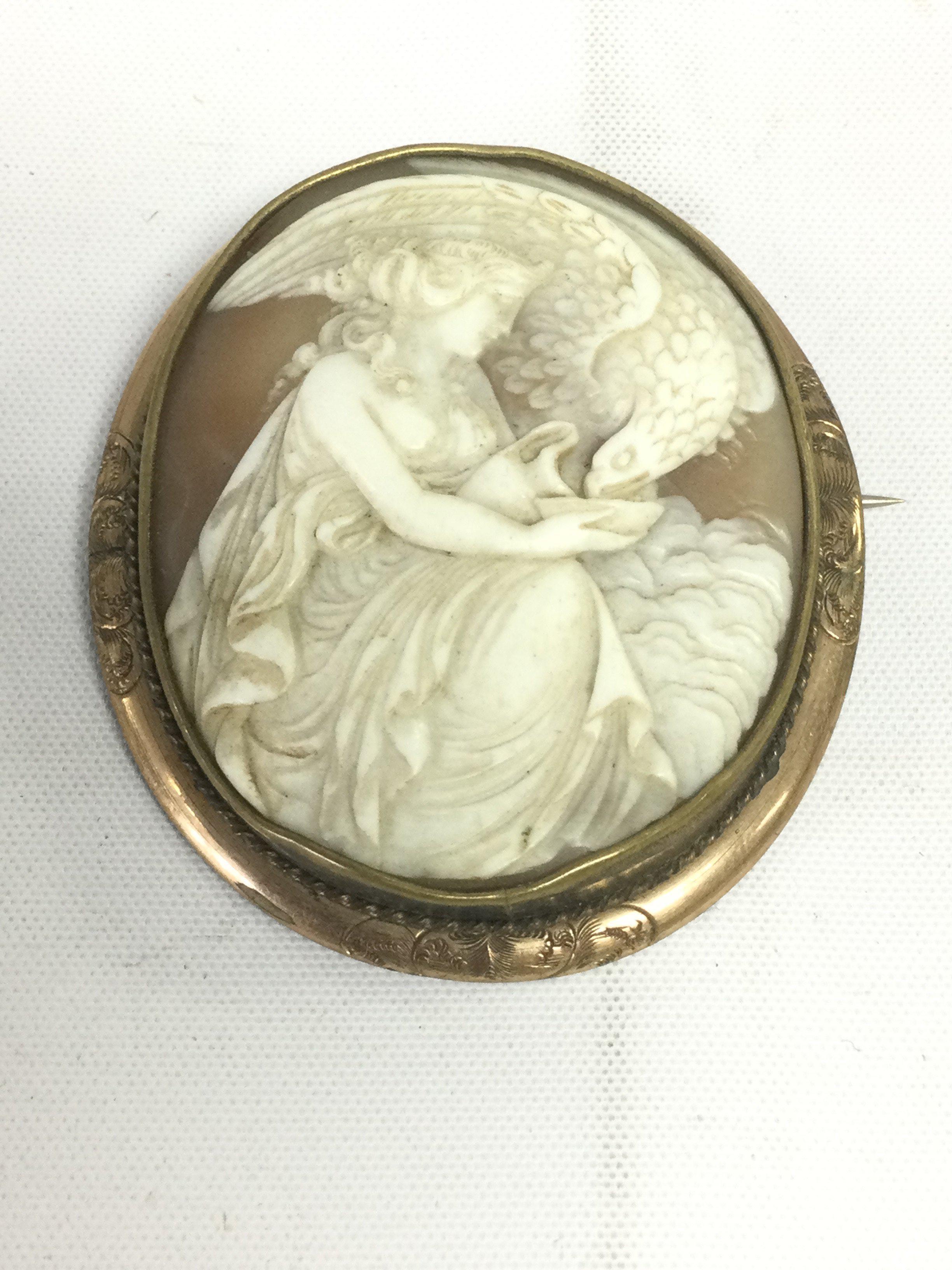 A large cameo brooch in a yellow metal mount, approx length 6.5cm. Shipping category A.