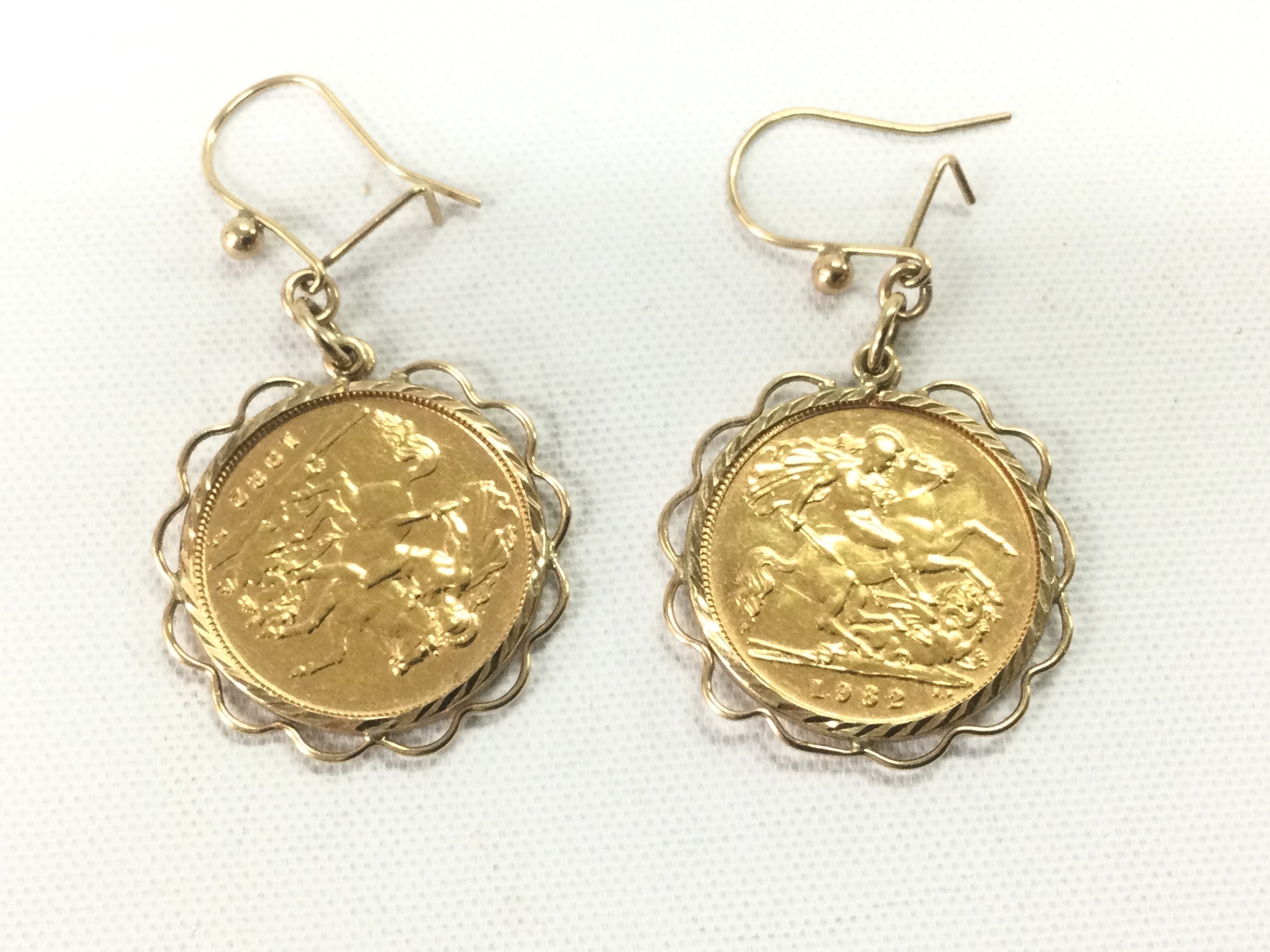 A pair of 1982 half sovereign earrings, approx 10g. Shipping category A.