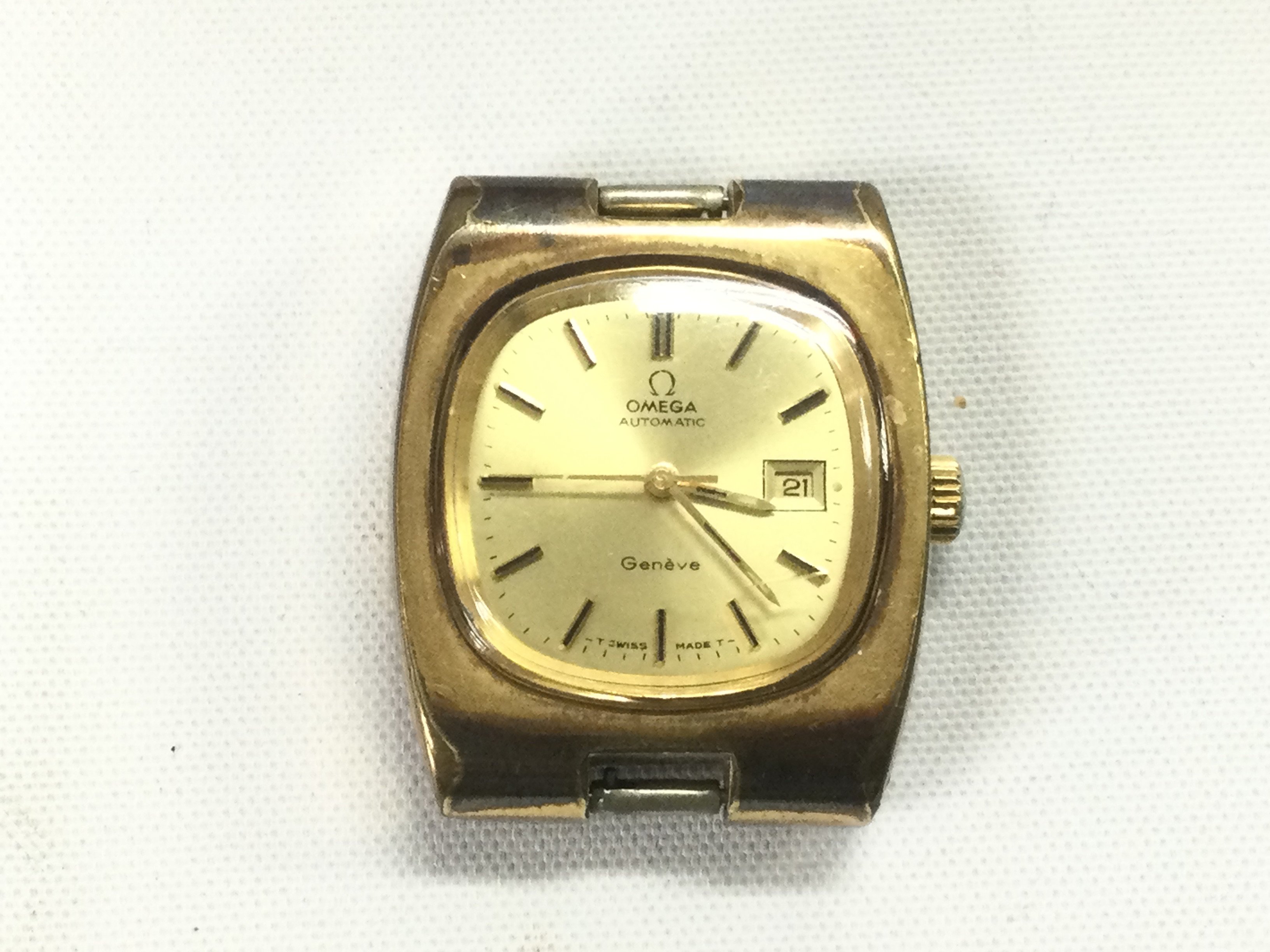 An Omega watch, no strap. Box and paperwork included. Shipping category B.