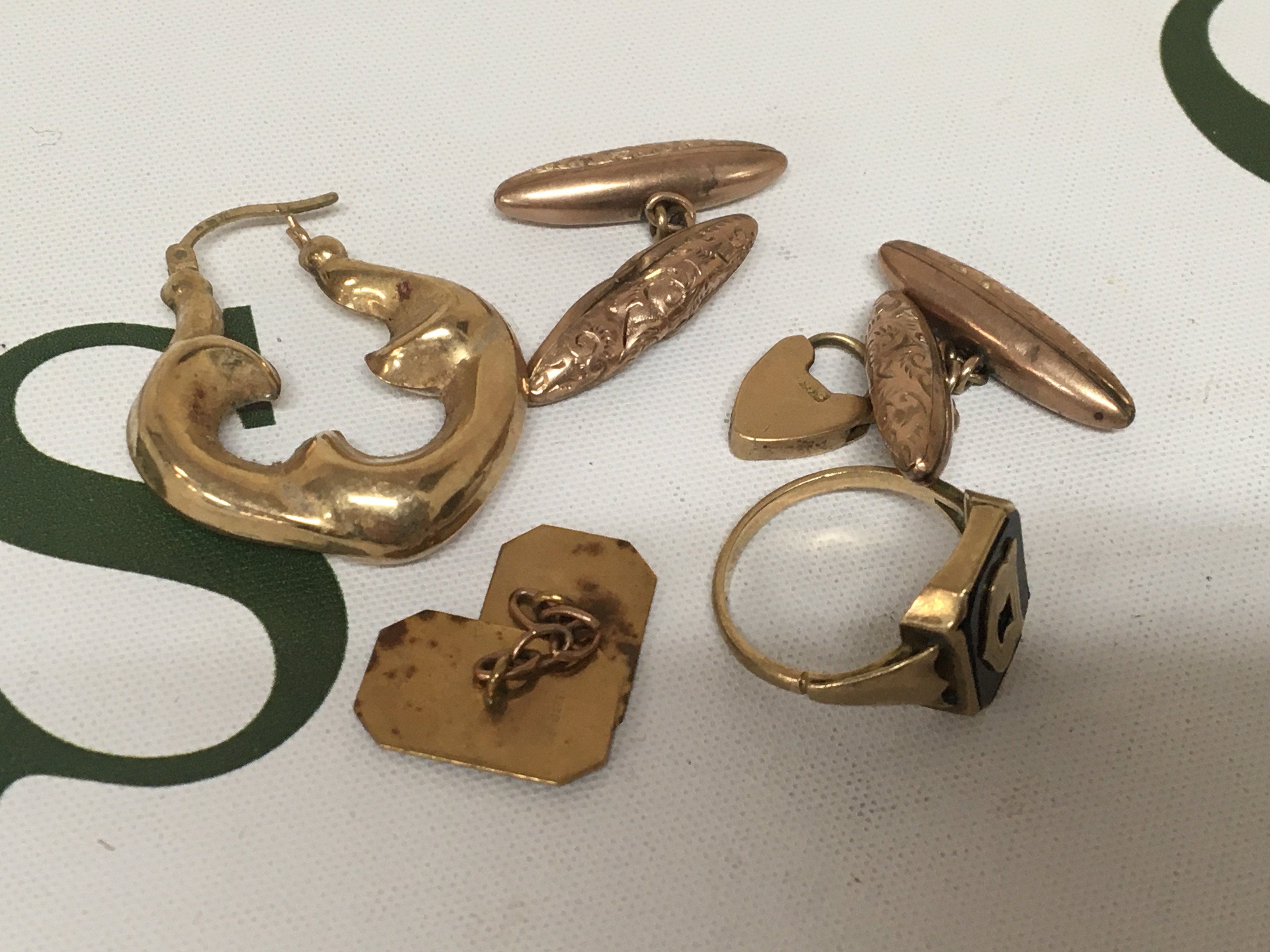 A collection of 9carat gold cufflinks an earring ring and other oddments. 12.5g